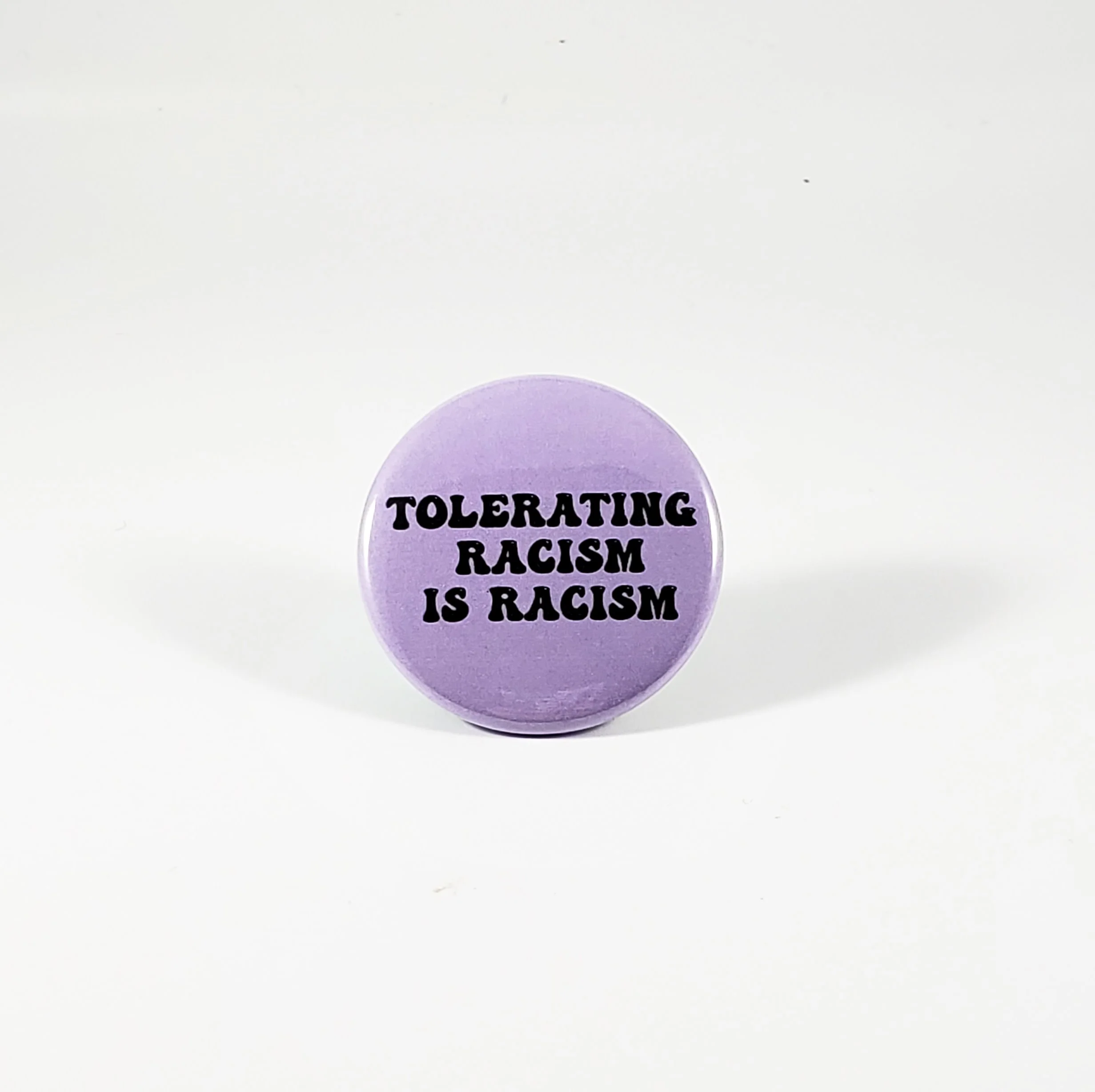 Tolerating racism is racism pin