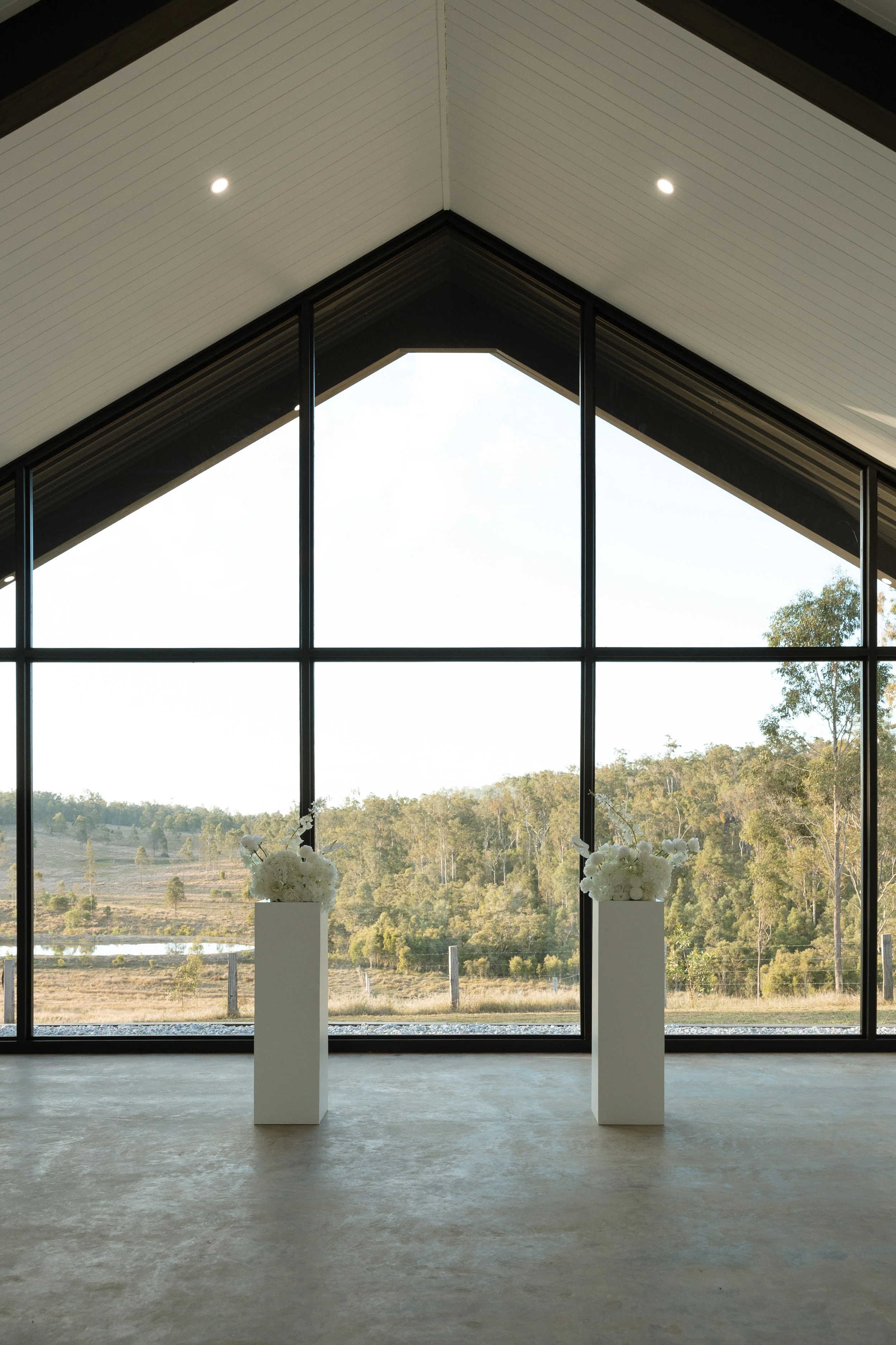 All-inclusive elopement styling in Hervey Bay showcasing plinth florals and ceremony décor at  the Blue Gum Station wedding venue.
