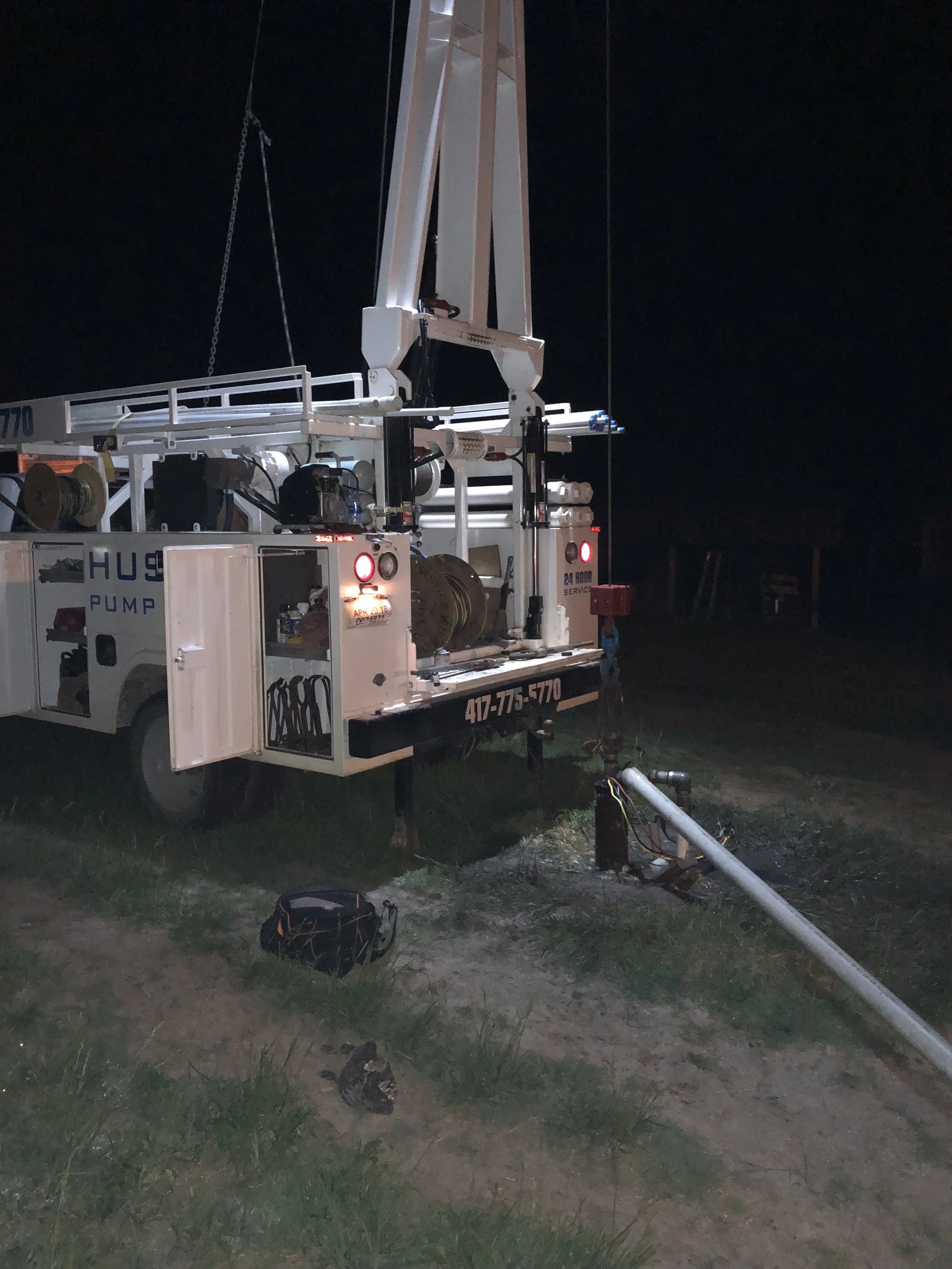 Pulling a Submersible Pump at Night
