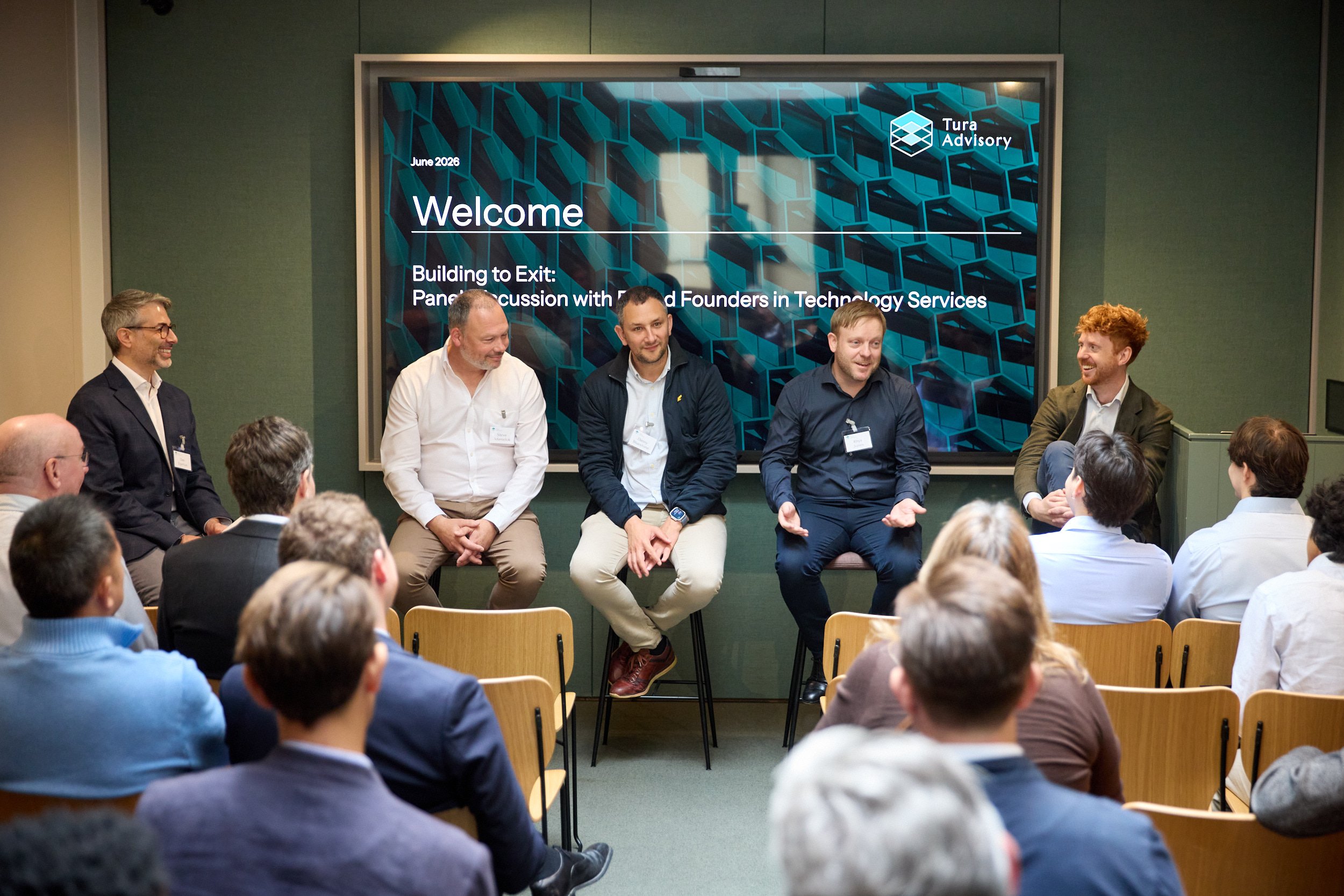 image of the panel speakers engaged in conversation