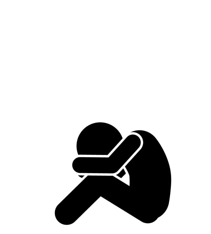 Silhouette of a person sitting with knees drawn up and head resting on their arms, suggesting sadness or grief.