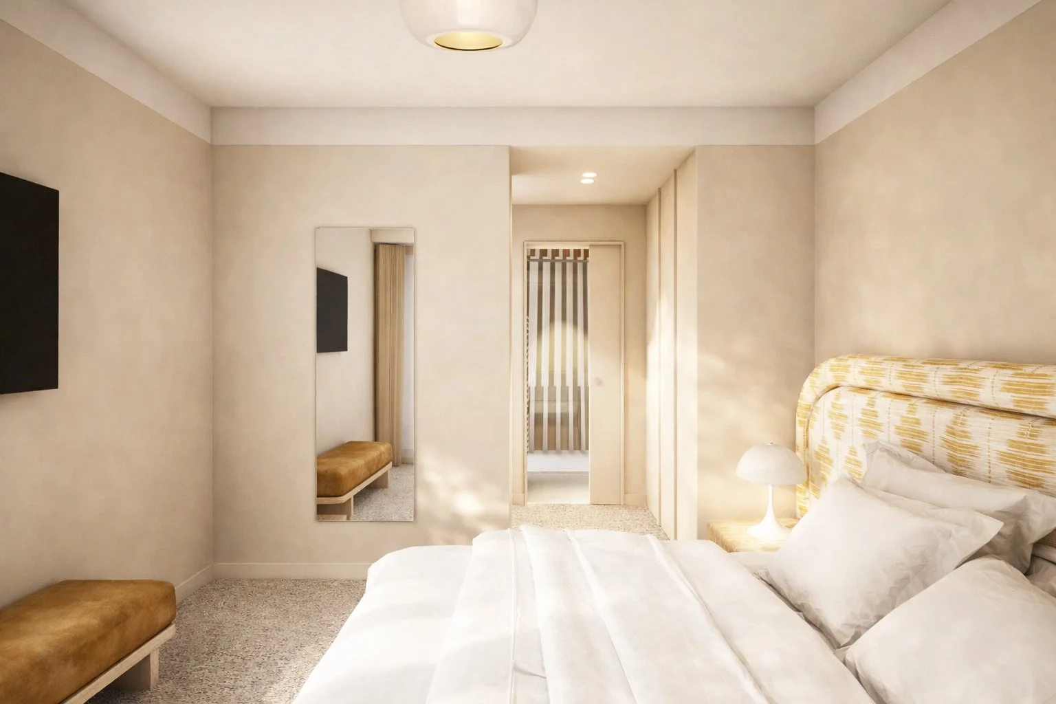 Sol en moquette Balsan, tête de lit imposante en tissu Elitis. L'accès à la salle de douche se fait par le dressing sur mesure.