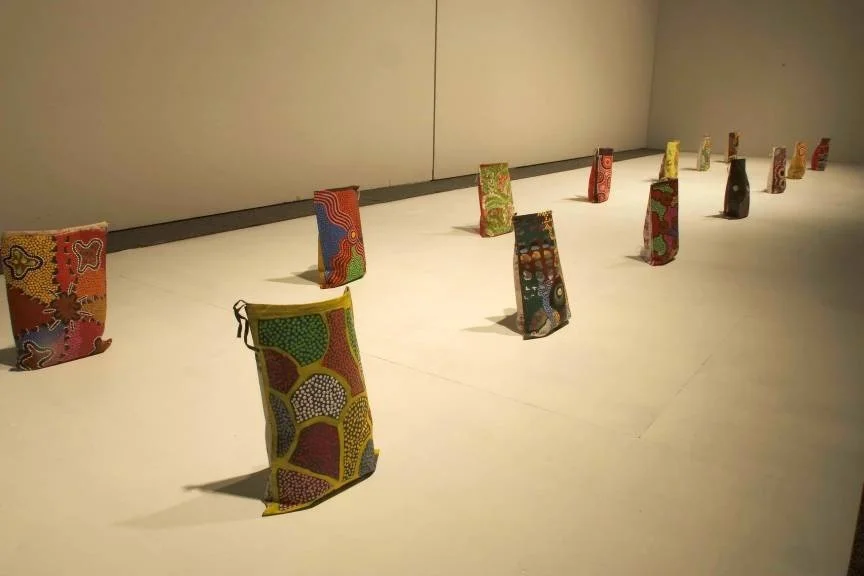 Irrunytju Artists, 'Untitled 1 - 12'. Calico geological sample bags, acrylic paint.