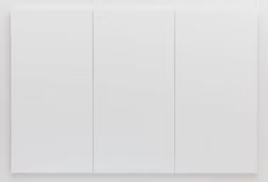 White kitchen cabinets with minimalistic design.