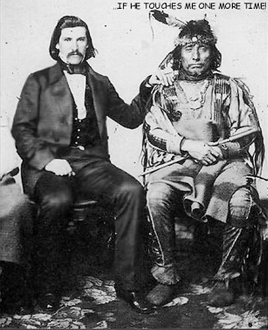 Historical photograph of a man in Western attire touching a Native American man in traditional clothing, with a caption that says 'If he touches me one more time'.
