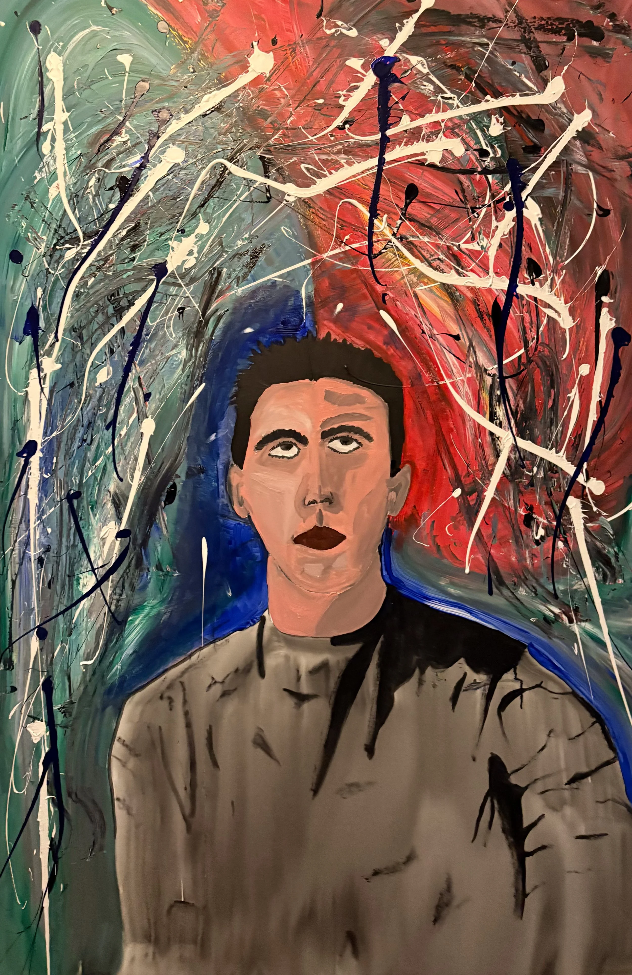 A portrait of a woman with short dark hair, wearing a light-colored top with small dark patterns, set against an abstract background with splashes of red, black, white, and blue paint.
