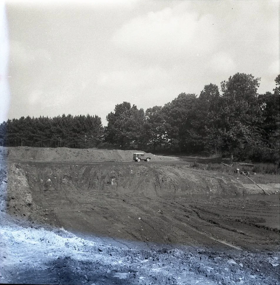 These photographs were taken in 1964 as land was cleared for the "Mast Hill development," which is now Silvermine Road. This location was known as Mast Hill for the large trees that once grew here which were cut down and sold to the shipyar