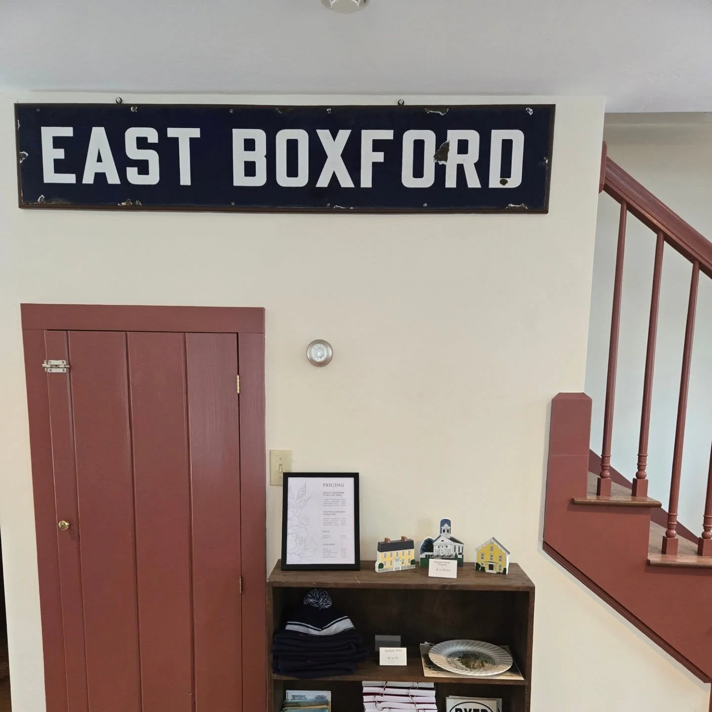 Then and now! The original sign from the East Boxford train station is now located at the Boxford Historical Society! This old photograph from the Document Center shows the sign when it was in use at the station. The man standing in the corner is Cha