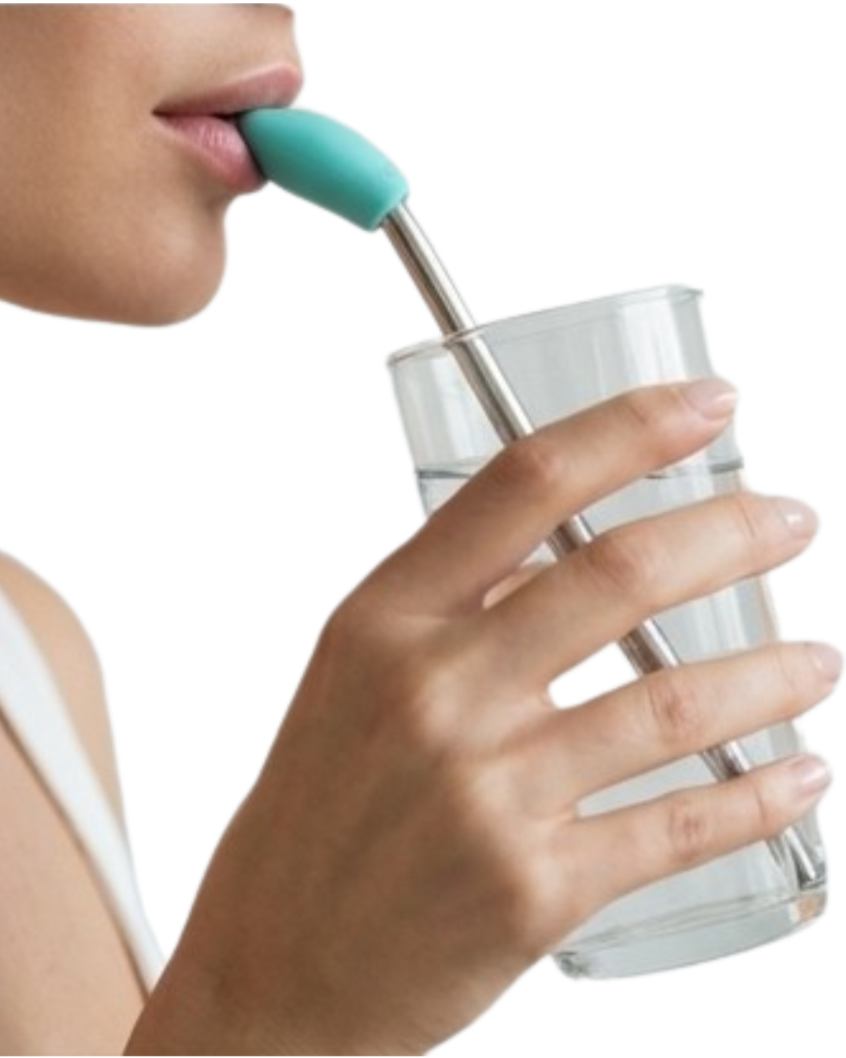 woman holding a clear glass of water with stainless steel straw and teal wrinx straw attachment
