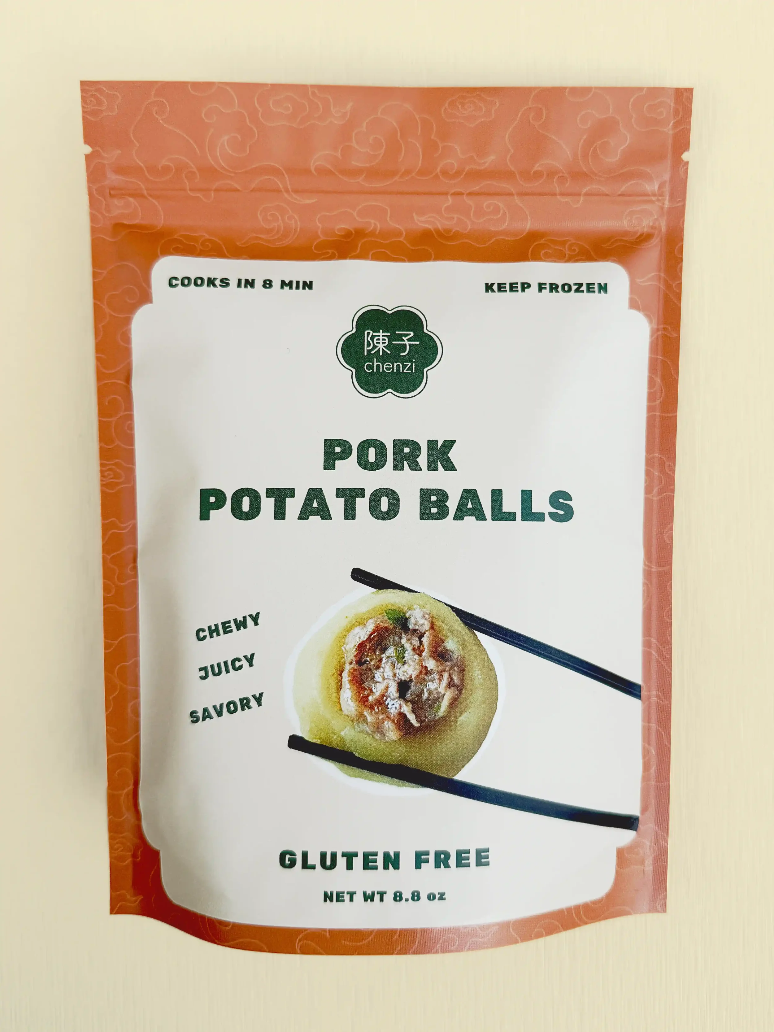 Chenzi’s packaged bag of pork potato balls, labeled chewy, juicy, savory, and gluten-free. Cooks in 8 minutes and should be kept frozen.