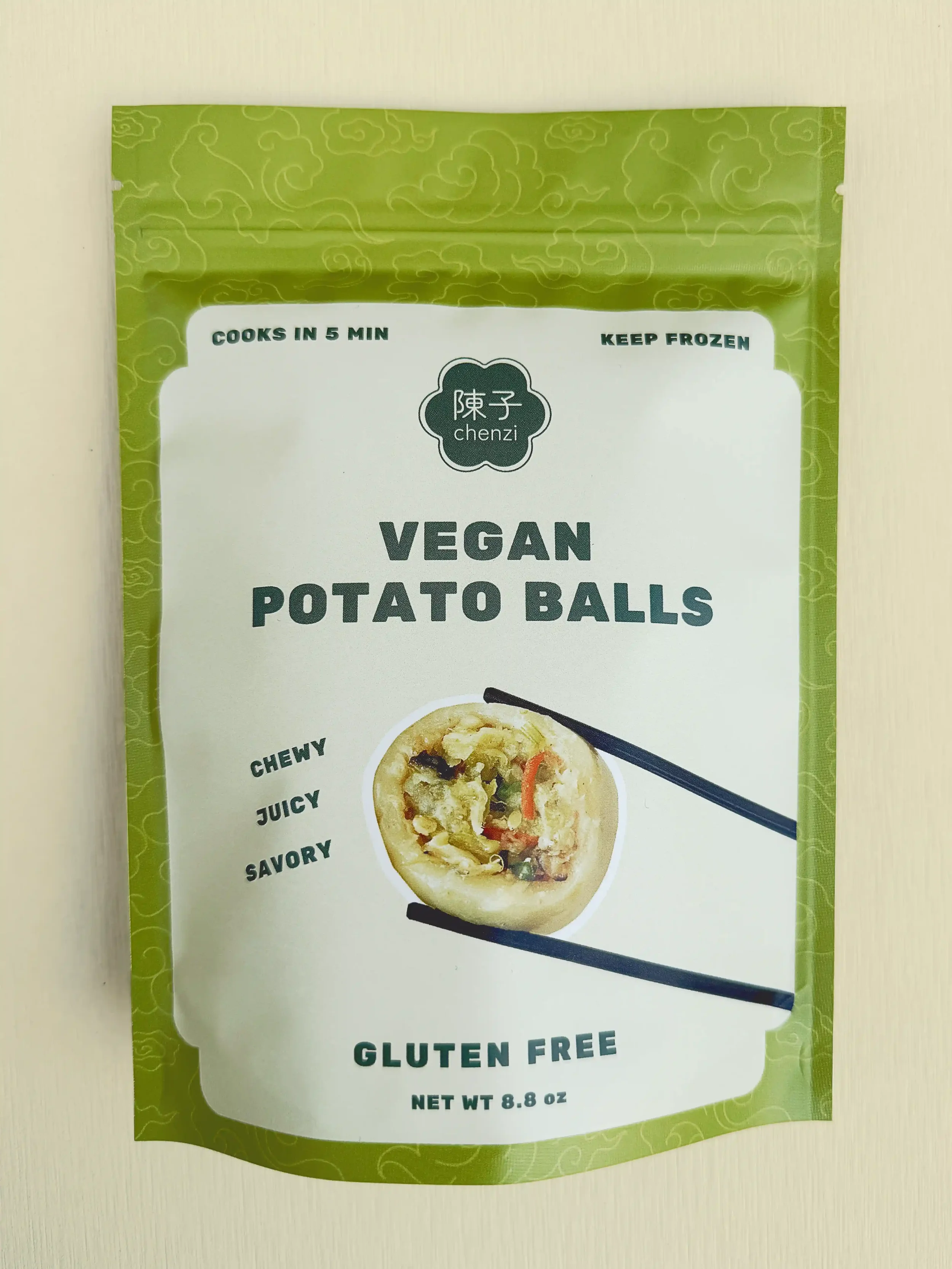 Chenzi’s packaged bag of vegan potato balls, labeled chewy, juicy, savory, and gluten-free. Cooks in 5 minutes and should be kept frozen.