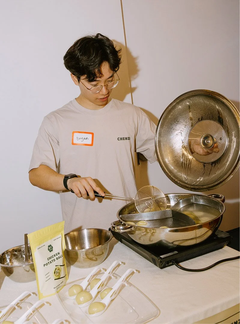 Bryan, co-founder of Chenzi, cooking Chenzi Fuzhounese potato balls at a Women's Day Lunch event.