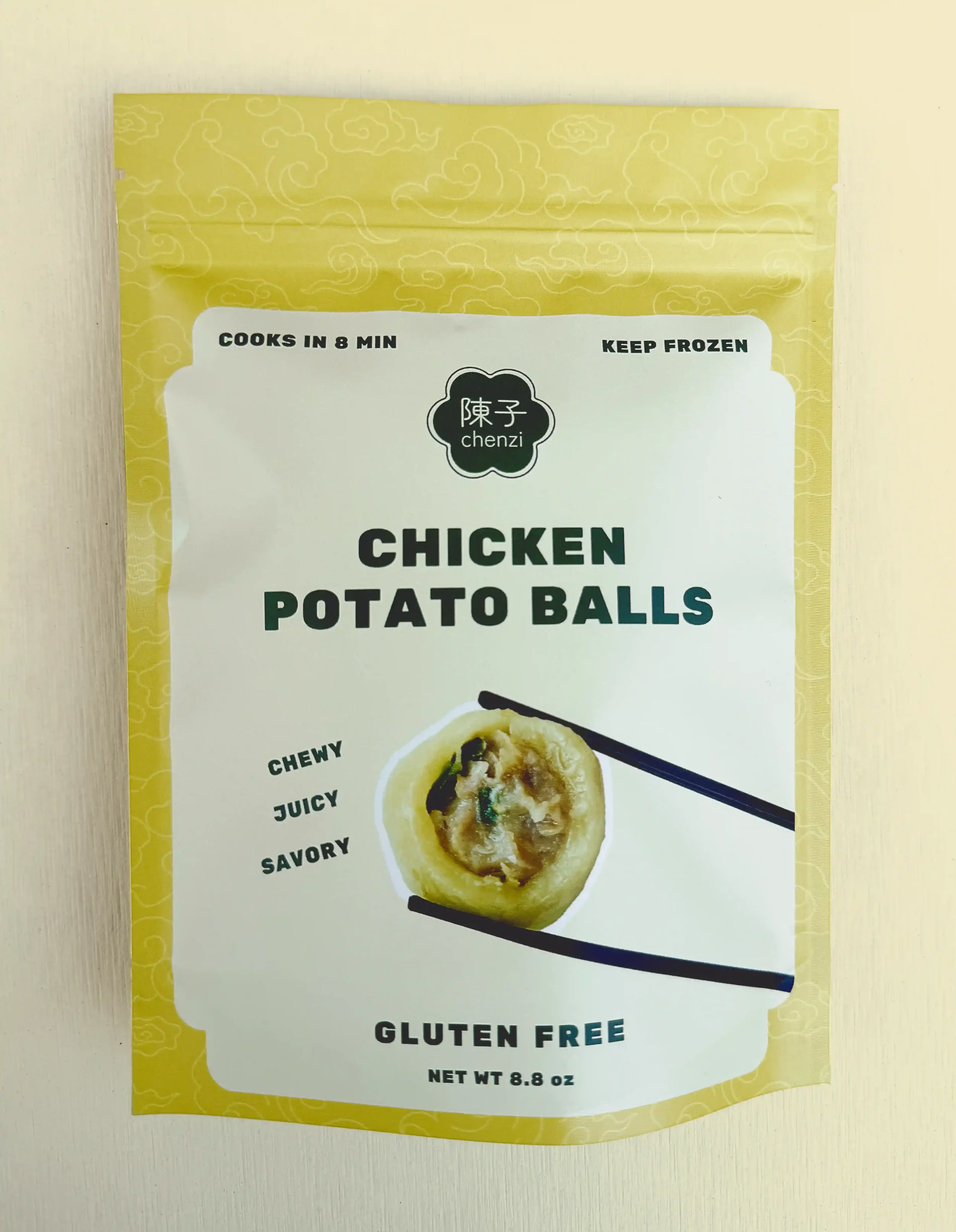 Chenzi’s packaged bag of chicken potato balls, labeled chewy, juicy, savory, and gluten-free. Cooks in 8 minutes and should be kept frozen.