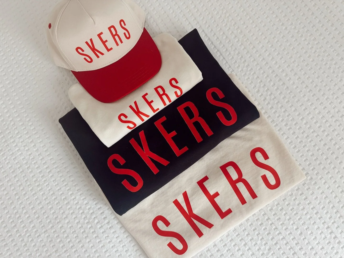 SKERS for the whole family 🫶🏼 this mama ordered a toddler hat, youth tee, adult boxy crop and a men&rsquo;s long sleeve to rep NE this season ❤️❤️

Our entire collection is completely customizable. We can do any top, any color, any design on size i