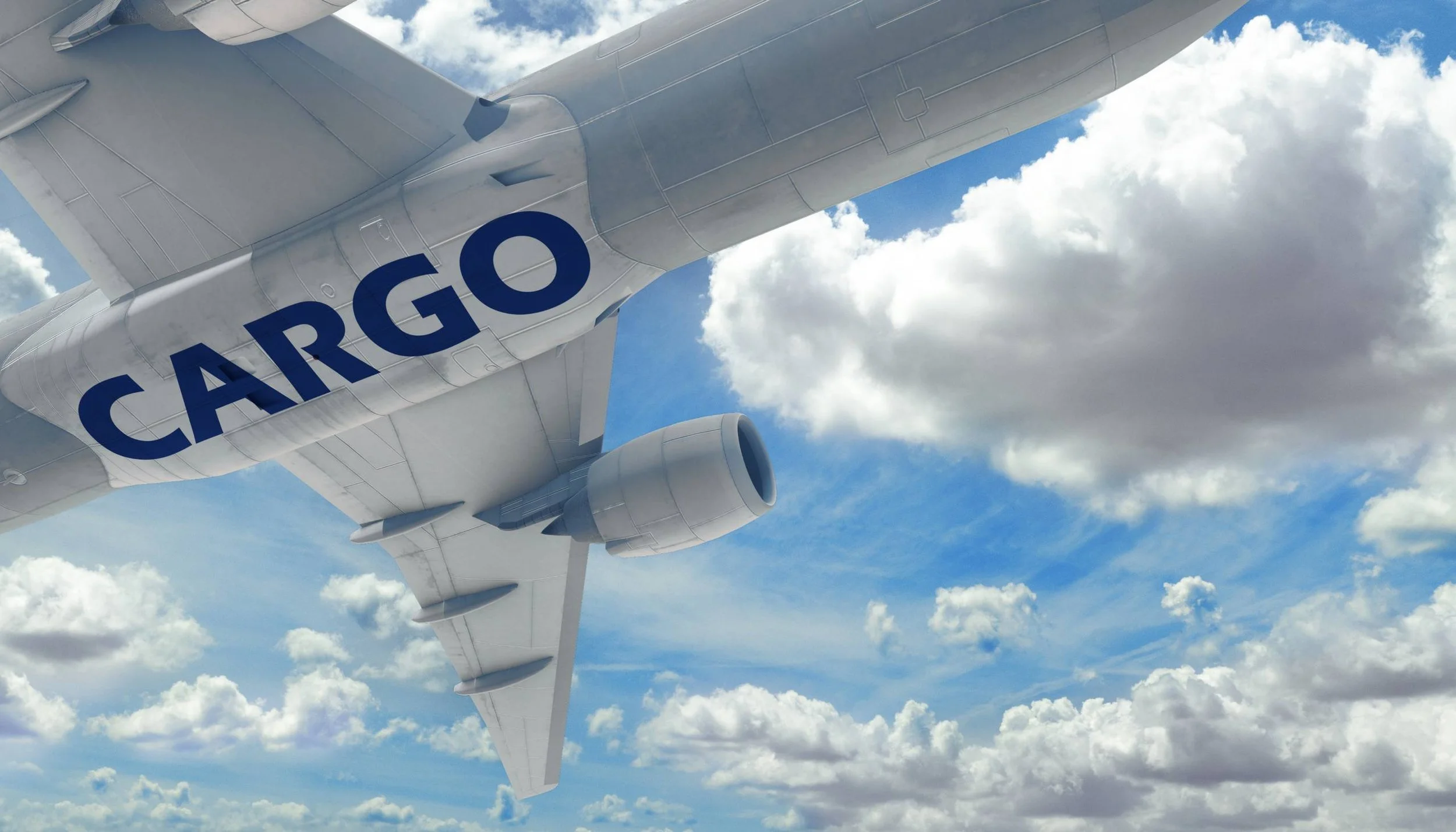 Cargo airplane flying in clear sky with scattered clouds, showing the word 'CARGO' on its side.