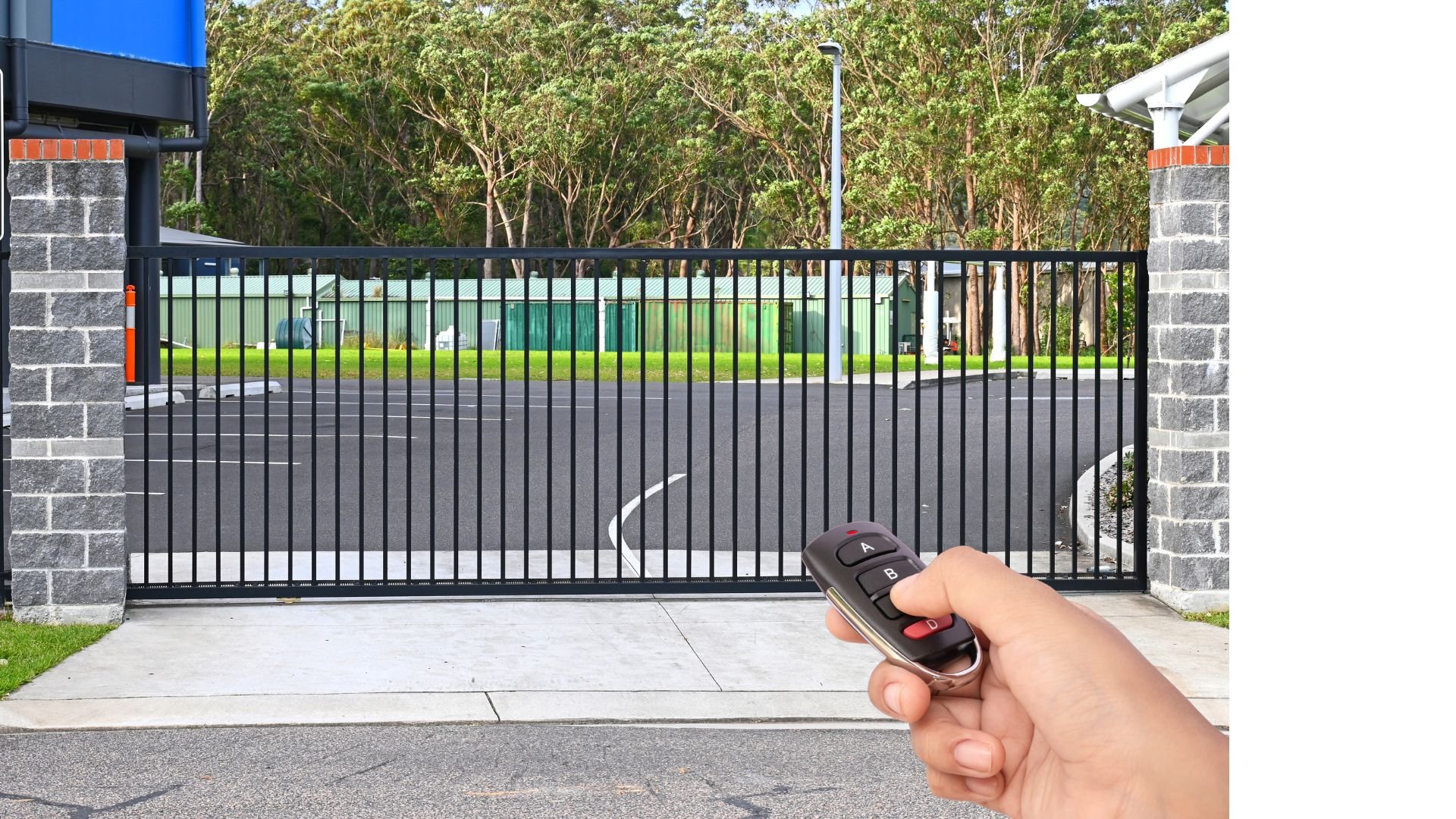 Automated sliding gate being opened with a remote control for secure vehicle access
