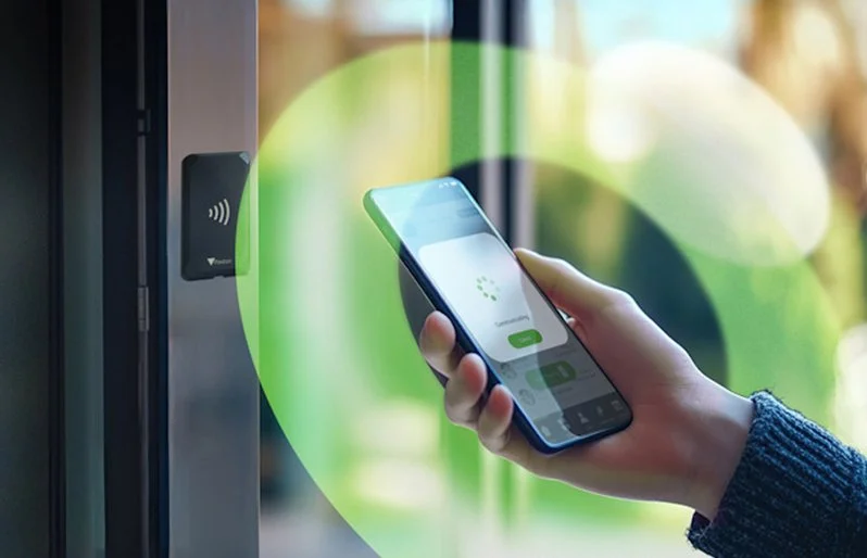 Paxton Solo access control being operated by smartphone at a secure door reader