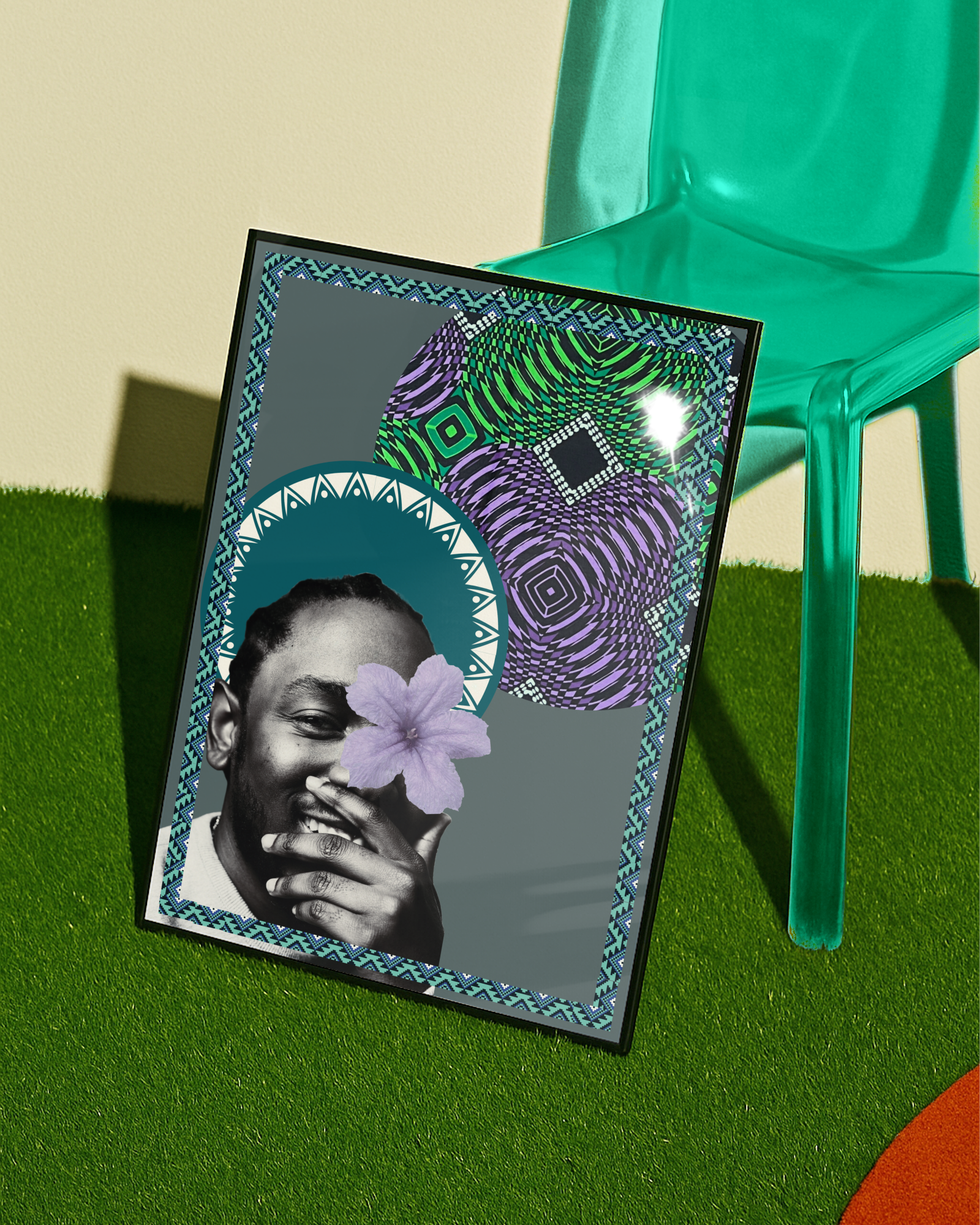 A framed black poster of Kendrick Lamar with a flower in front of his face, standing on green carpet, with a transparent green chair behind it.