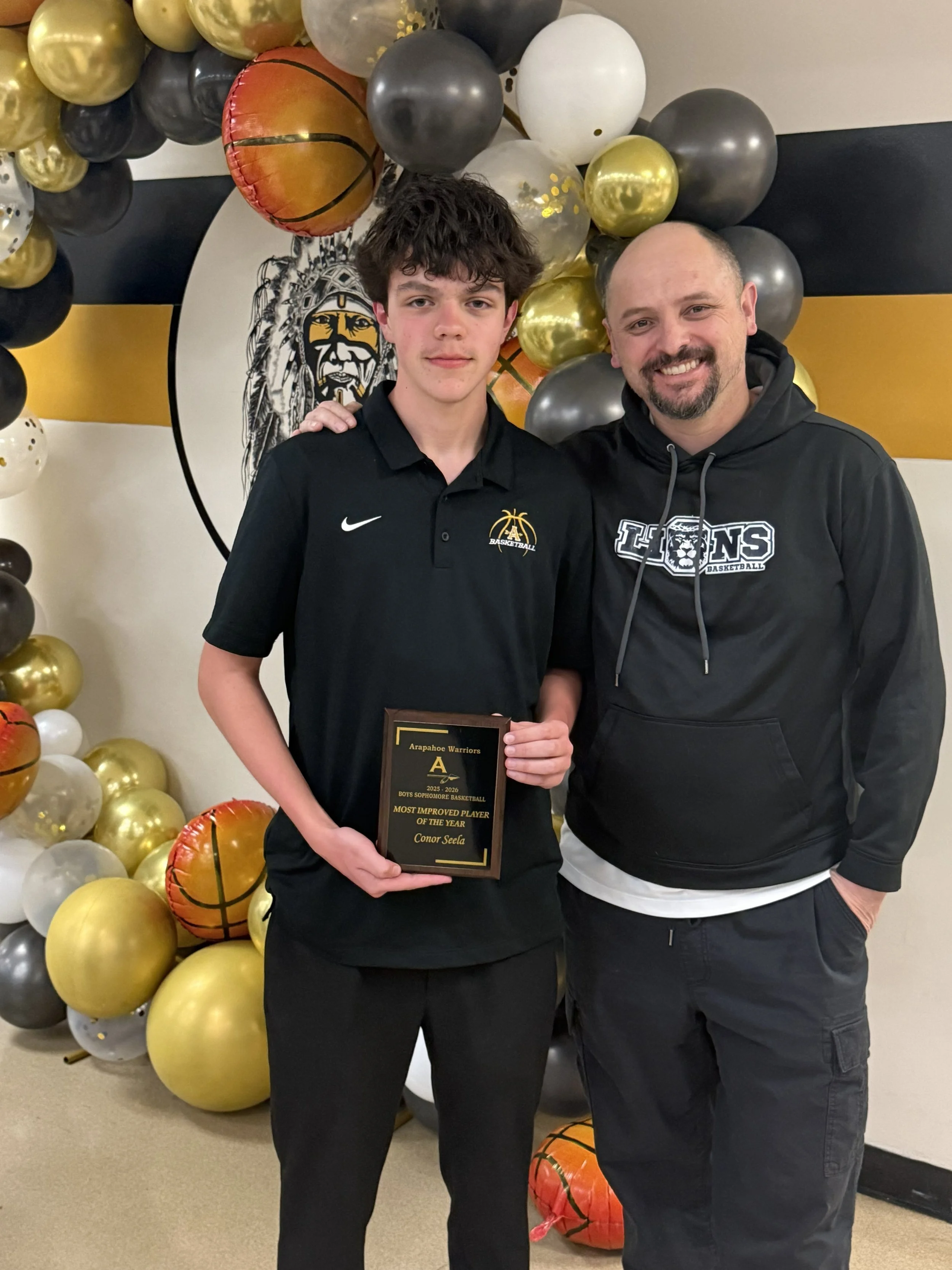 Lion Connor Seela wins the Most Improved Player Award for the Sophomore team at Arapahoe High School.