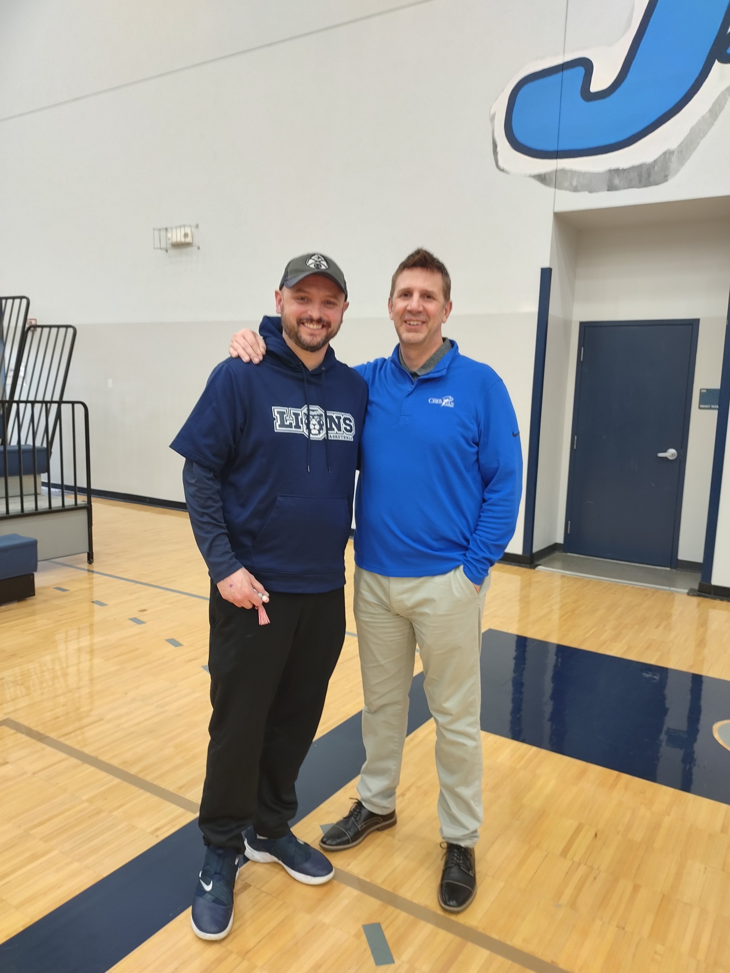 Coach Reggie serving as chaplain for the Denver Christian High School Boys Team led by Head Coach Kevin Boley.