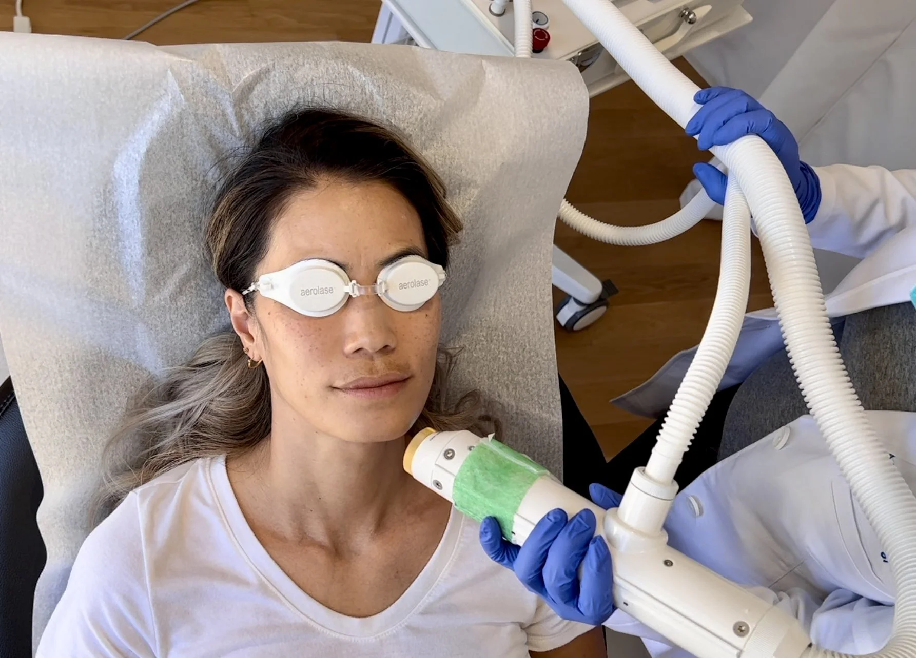 A woman receiving an Aerolase laser treatment.