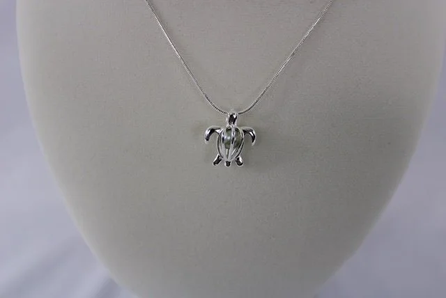Sydnee turtle lt green pearl necklace.JPG