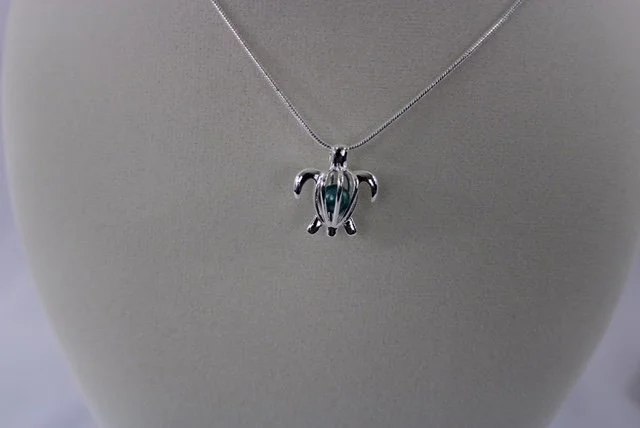 Sydnee turtle blue pearl necklace.JPG