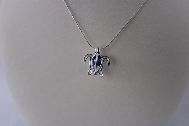 Sydnee tutle blue pearl necklace.JPG