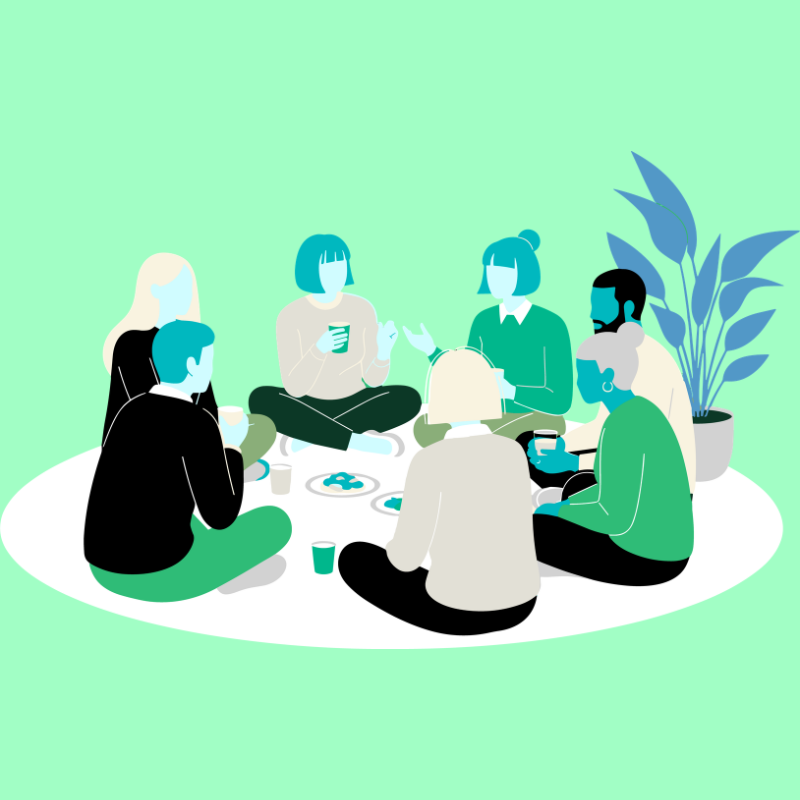Six people sitting on a white rug, having a casual gathering with drinks, in a room with a large potted plant.