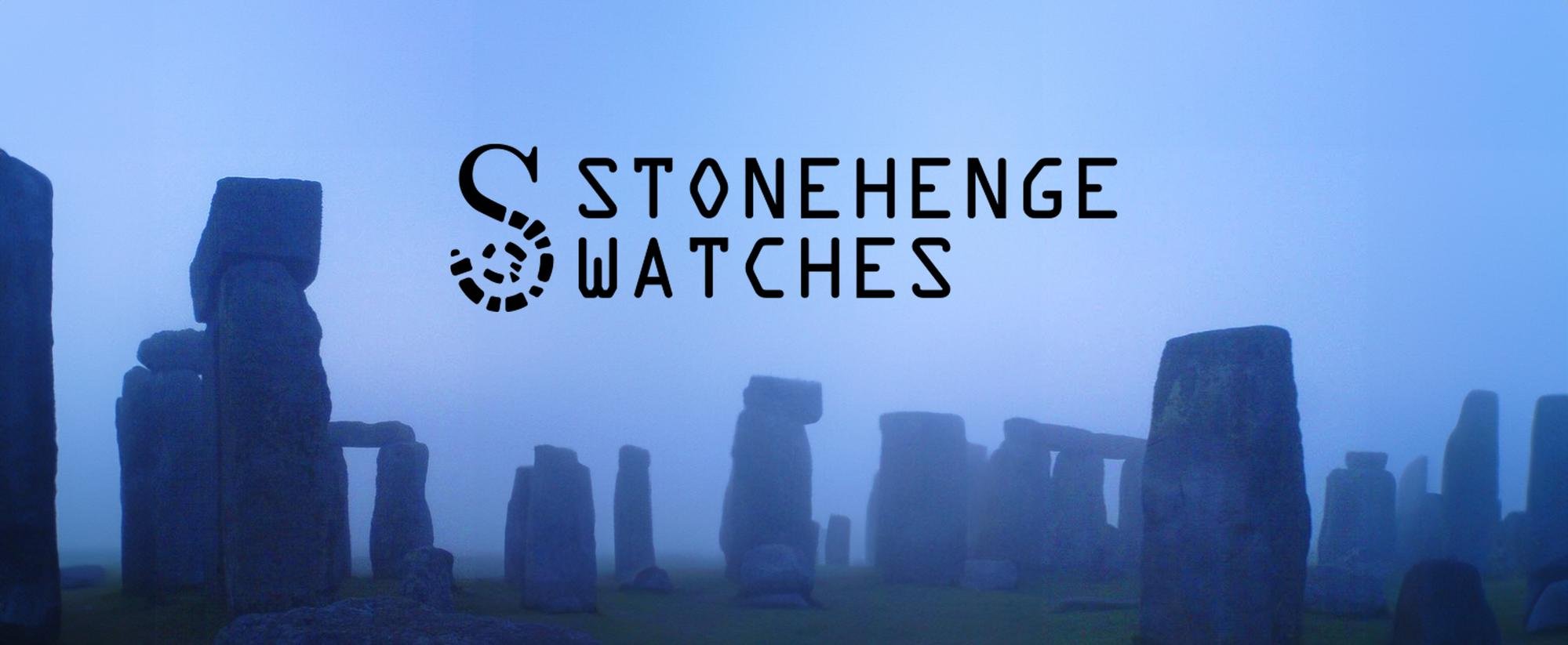 Logo of Stonehenge Watches over a foggy Stonehenge monument with standing stones in the background.