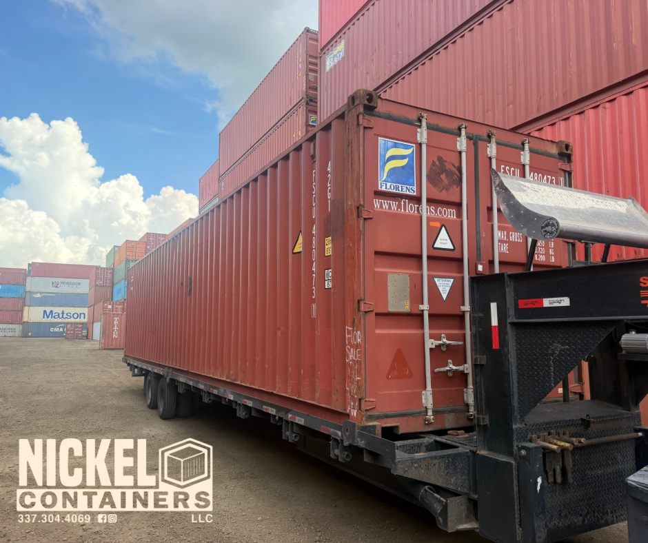 A used 40 Ft. Shipping container loaded up on a trailer to be delivered by Nickel Containers, LLC.