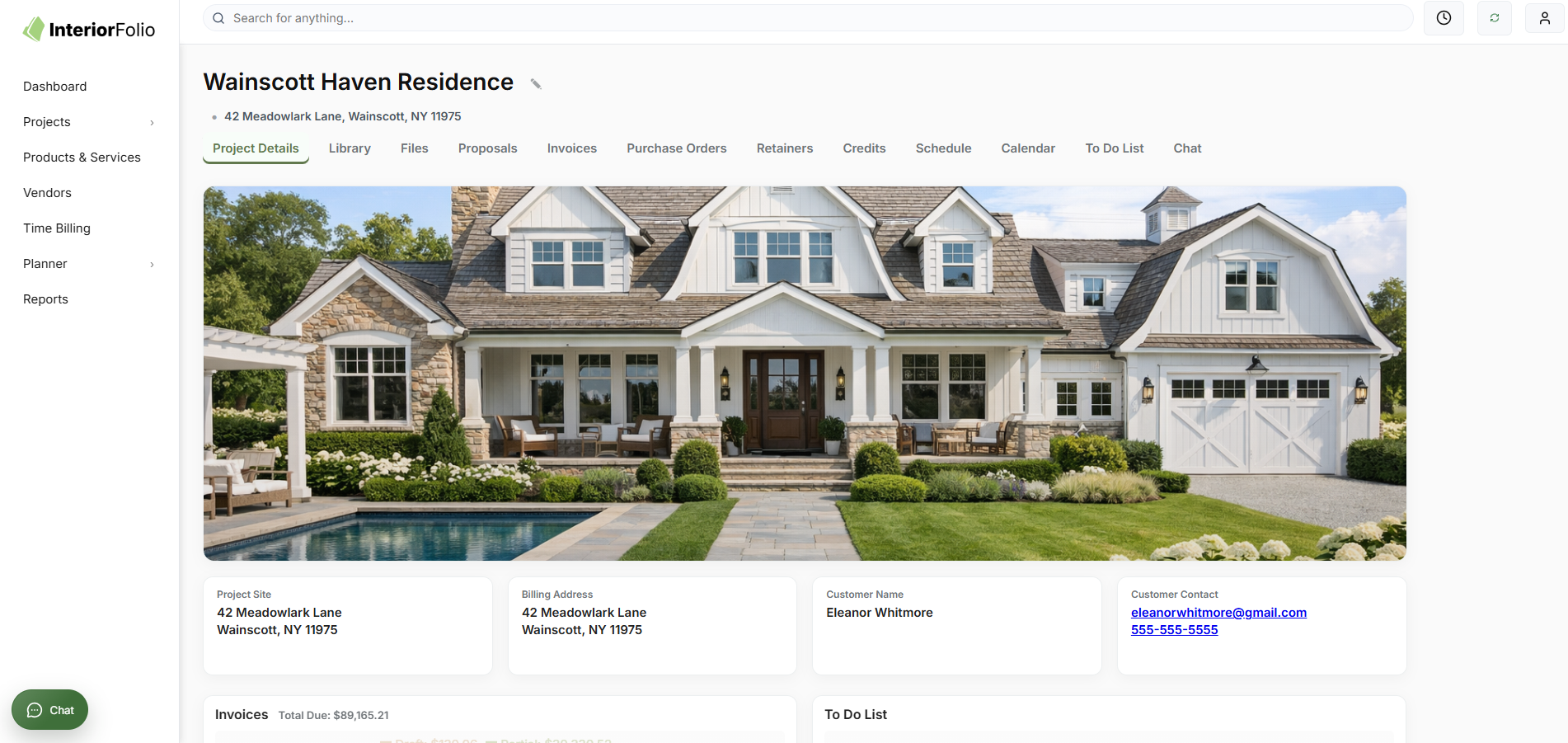 The image shows the homepage of a project management platform called InteriorFolio with a focus on a residence project named Wainscott Haven Residence. The main part of the screen features a large image of a white, two-story house with a landscaped yard, a swimming pool, outdoor seating, and multiple dormer windows. On the left sidebar are menu options like Dashboard, Projects, Vendors, and others. The project details include the site address, billing address, customer name, and contact information of Eleanor Whitmore.