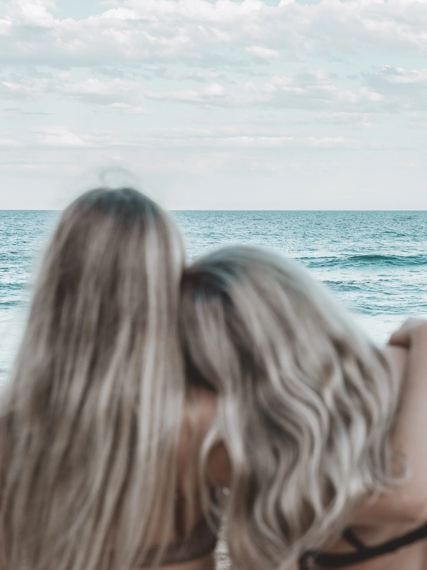 Side by side, soaking in the horizon. 

Blonde, sun kissed, and softly shimmering. Hair nourished with fermented rice water and honey for strength, shine, and effortless movement long after the waves. 

For every kind of together.