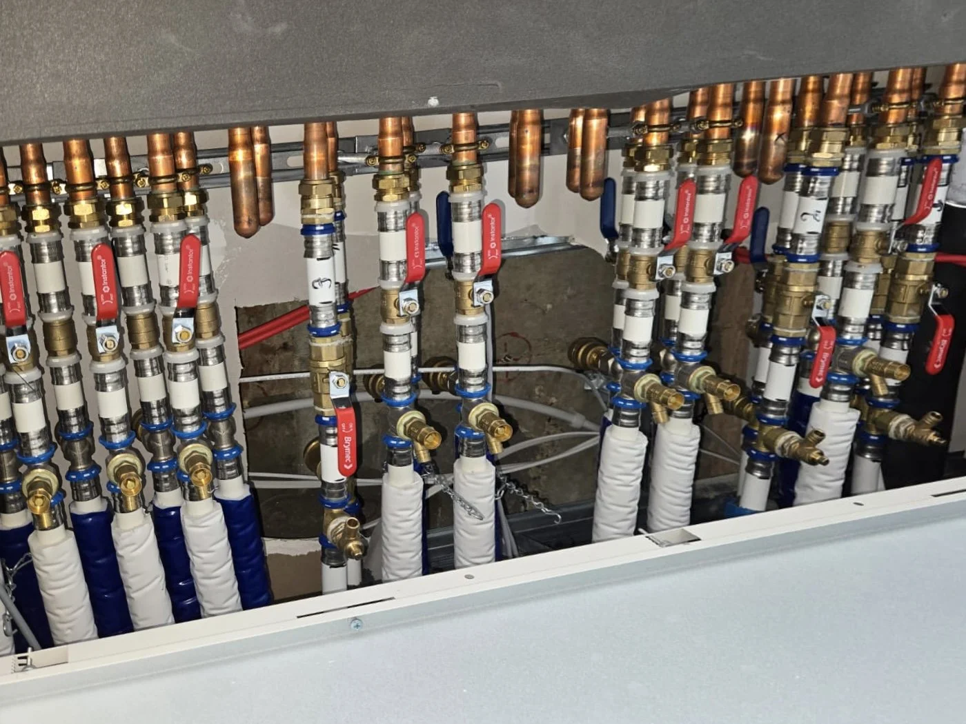 BC Box & Pipe Runs - Every flow and return is clearly labelled, colour-coded, securely clipped, and commissioned to specification for optimal system performance.