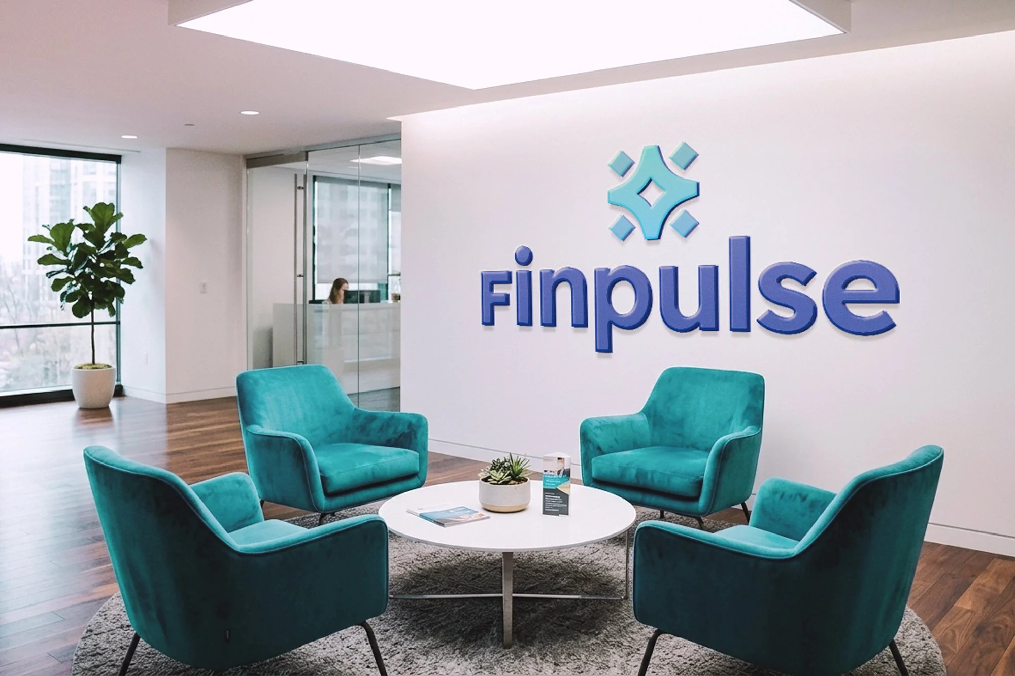 Modern office reception area with four teal velvet armchairs arranged around a white circular coffee table on a gray rug, a potted plant, and a large company logo on the white wall reading 'finpulse' in blue letters.