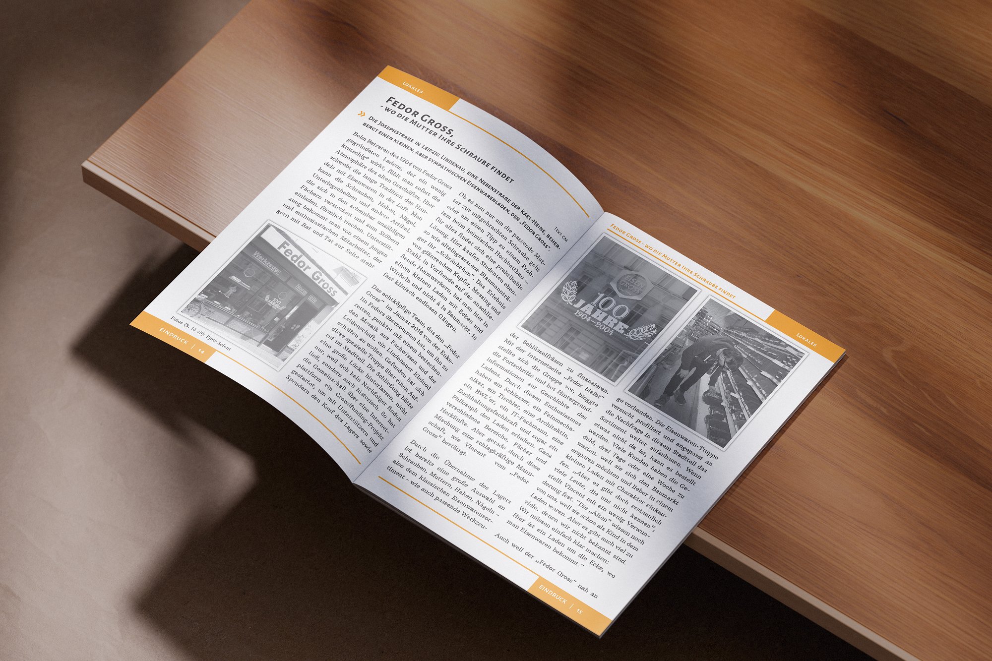 Open magazine on wooden table displaying two black-and-white photographs and German text and with orange borders and headings.