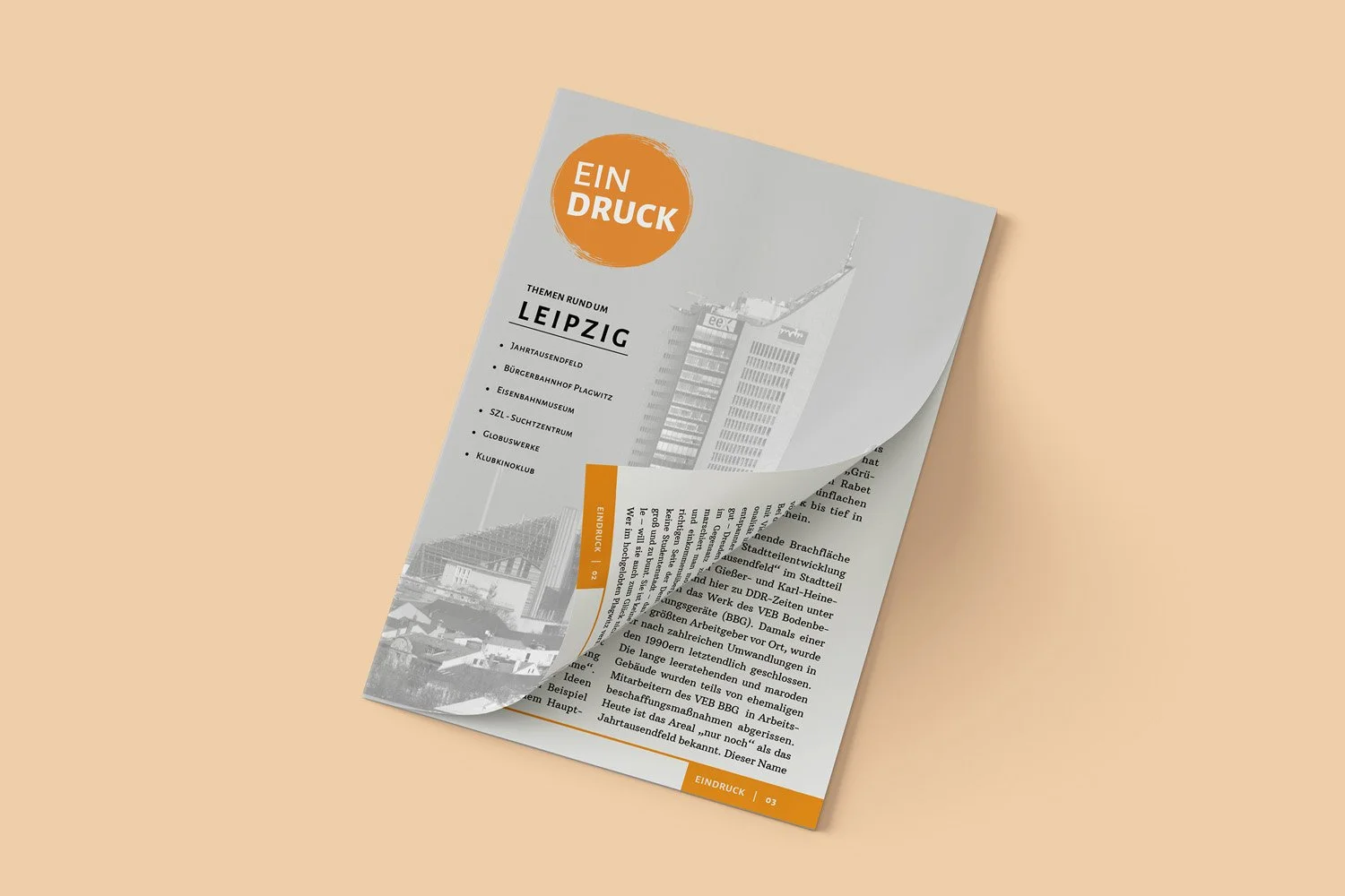A folded newspaper with the headline 'EIN DRUCK' in an orange circle, featuring a list of topics about Leipzig and a grayscale photo of a cityscape on a beige background.