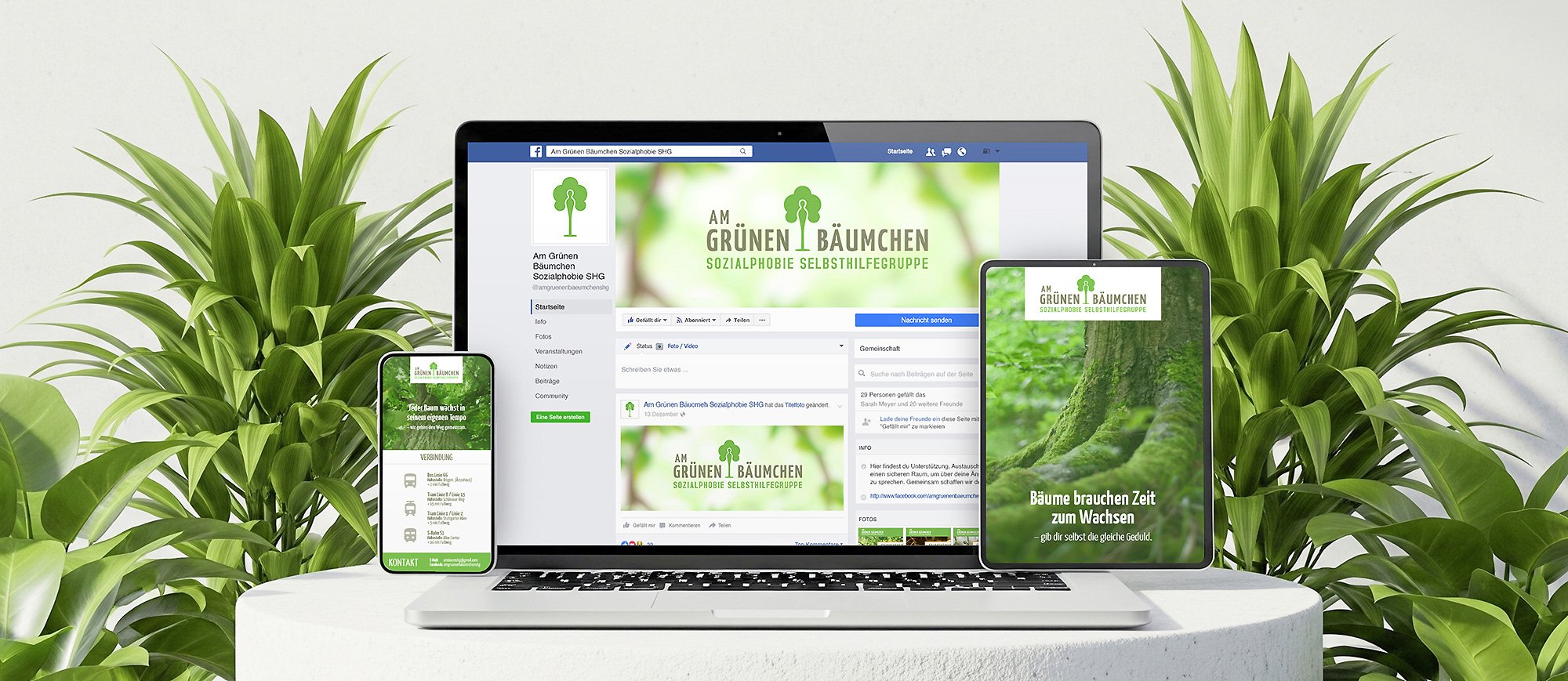 Facebook page on laptop, phone, and tablet screens displaying a green tree logo and the text "Am Grünen Bäumchen Sozialphobie Selbsthilfegruppe," surrounded by green plants.