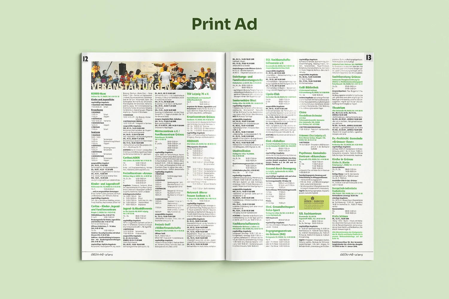 Open magazine with print ads on a light green background, showing pages filled with text, some in green font, and a small photo of a concert or performance at the top.