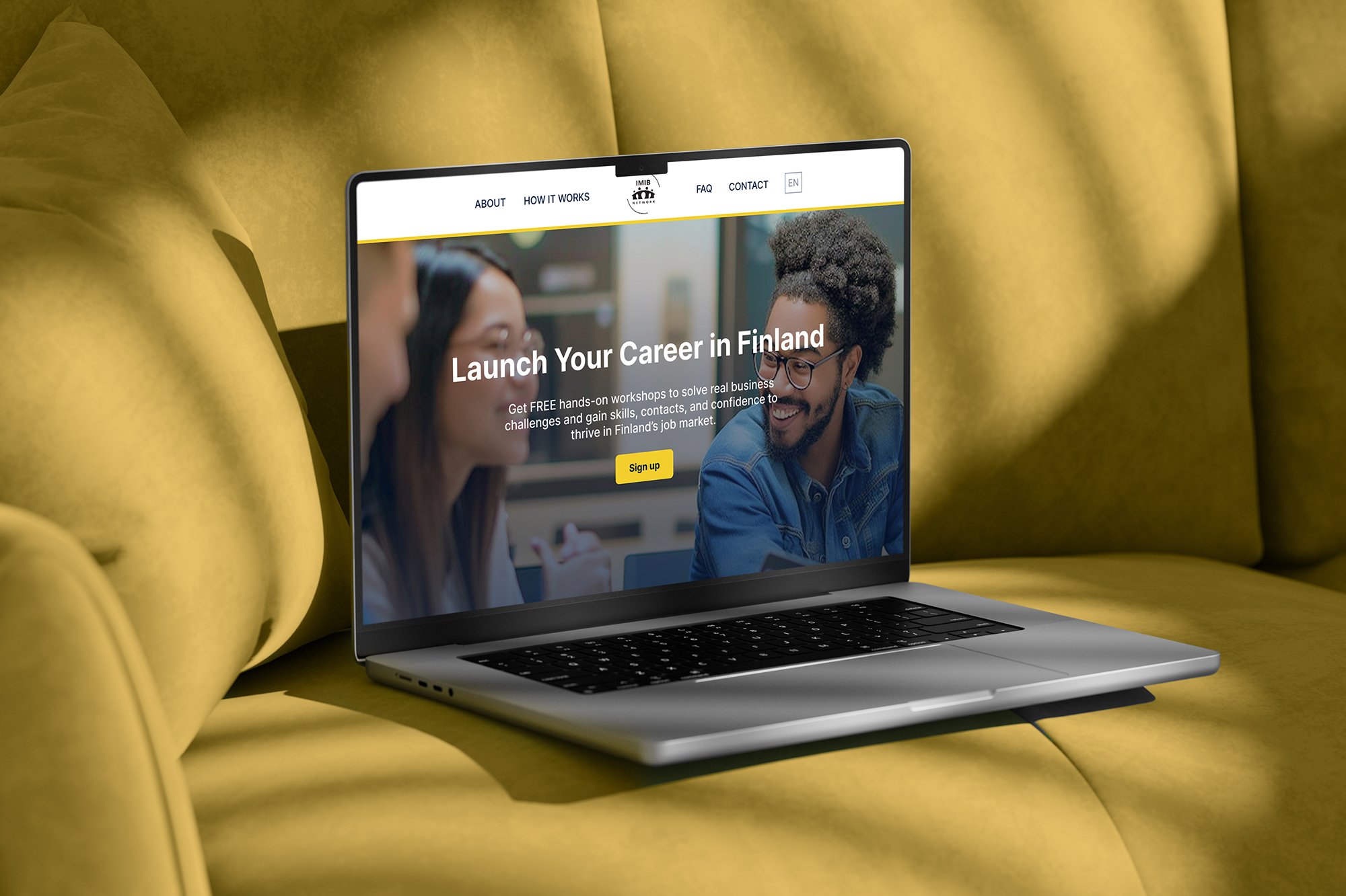 A laptop on a yellow couch displaying a website with the headline 'Launch Your Career in Finland' and a photograph of diverse smiling young people.
