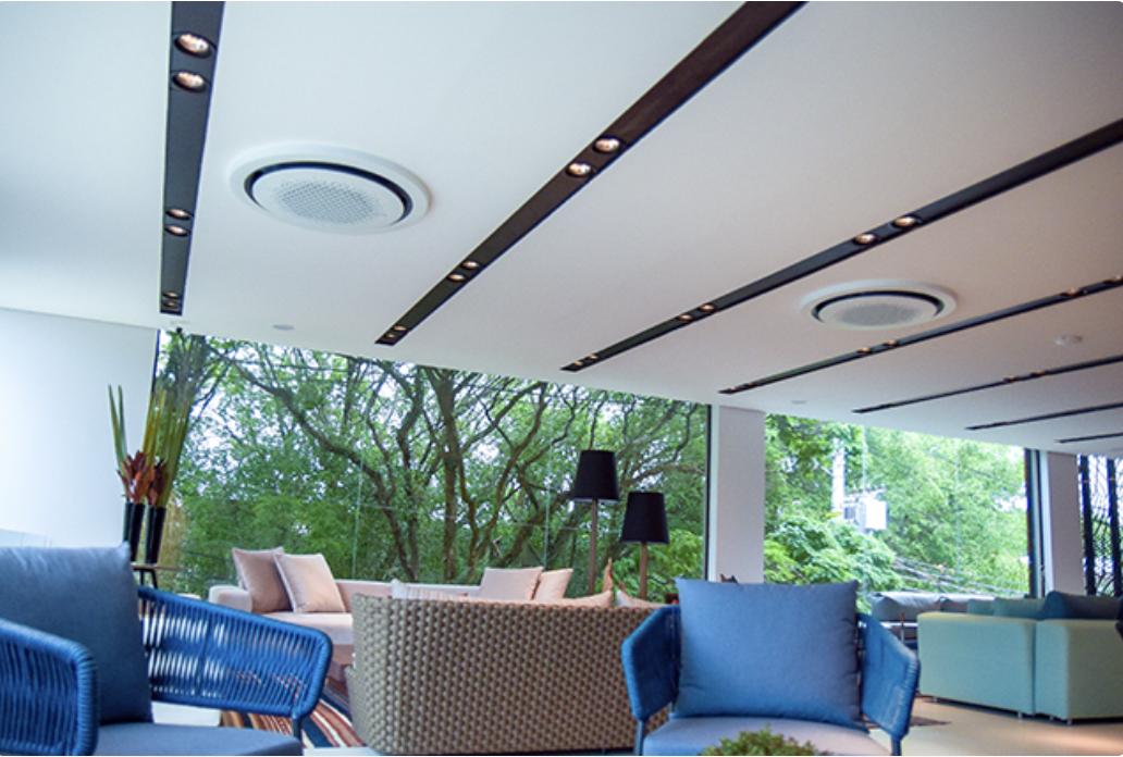 Modern interior living room with large windows, greenery outside, various colorful sofas, floor lamps, and ceiling lights.