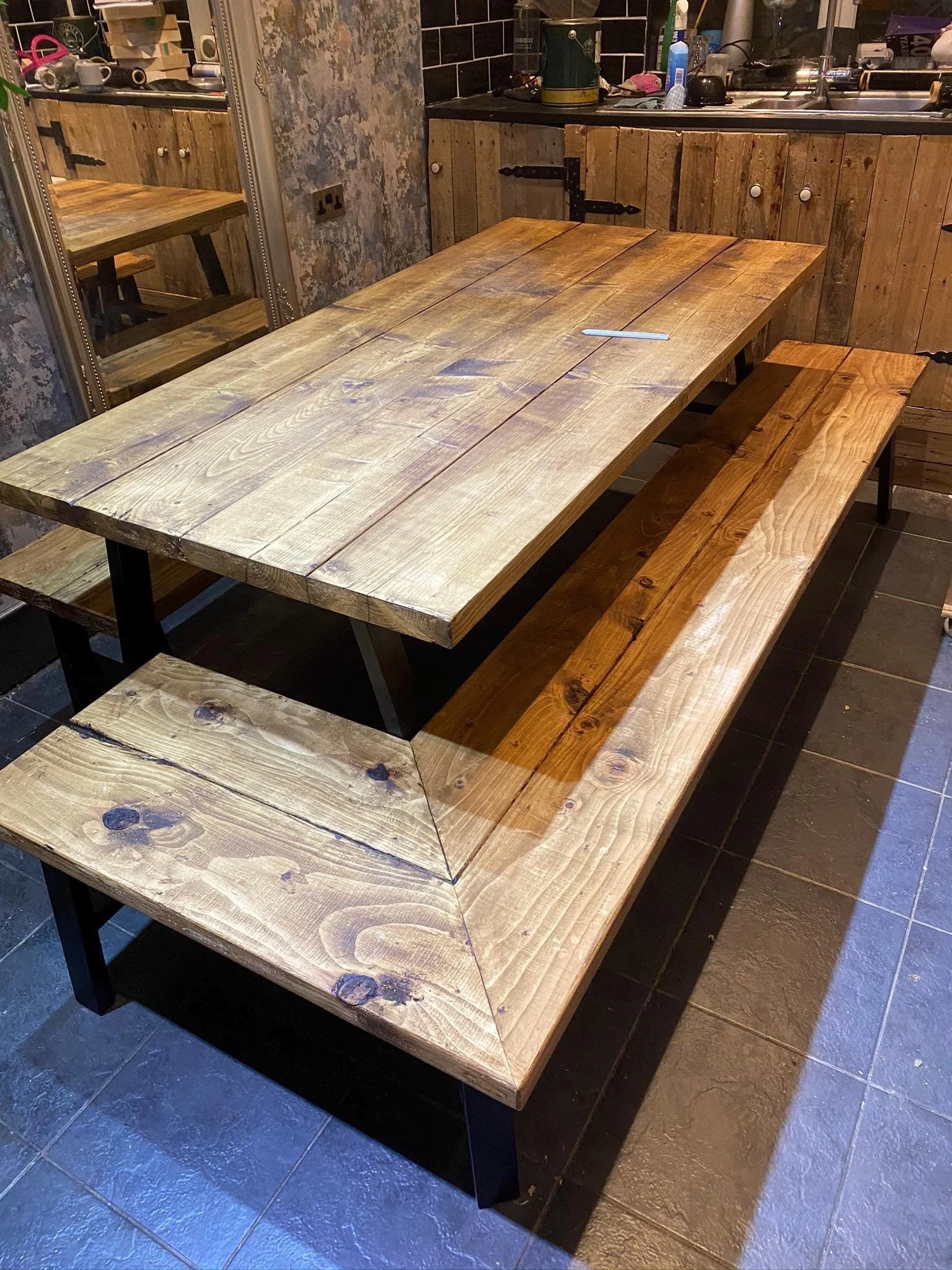 Handmade solid wood rustic farmhouse kitchen tables and benches with metal legs made from reclaimed pine