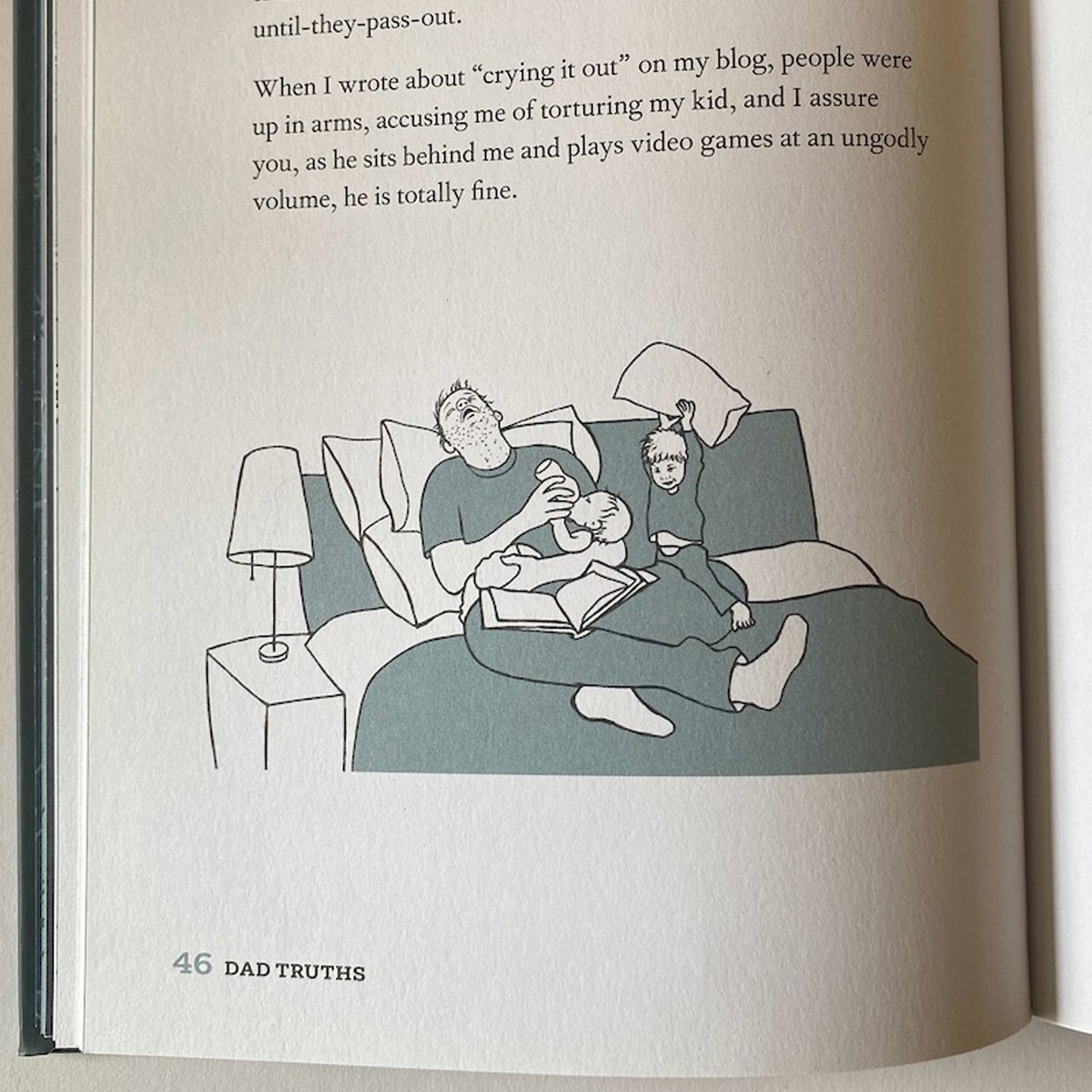 exhausted dad crashing out while feeding baby with toddler and pillow, line drawing for Dad Truths, illustrated by Terry Marks