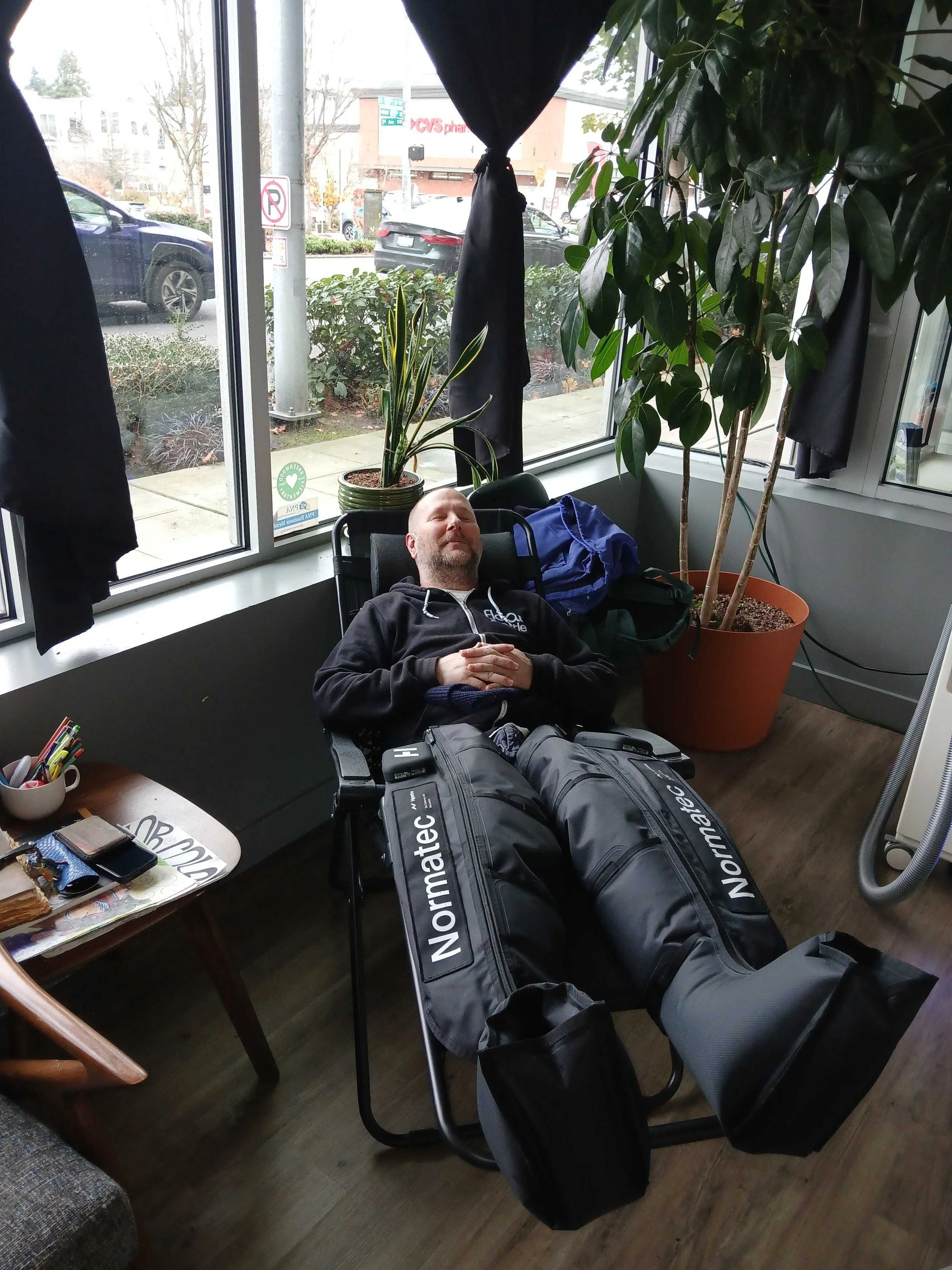 Normatec compression boots in the Recovery Corner at Float Seattle Greenwood