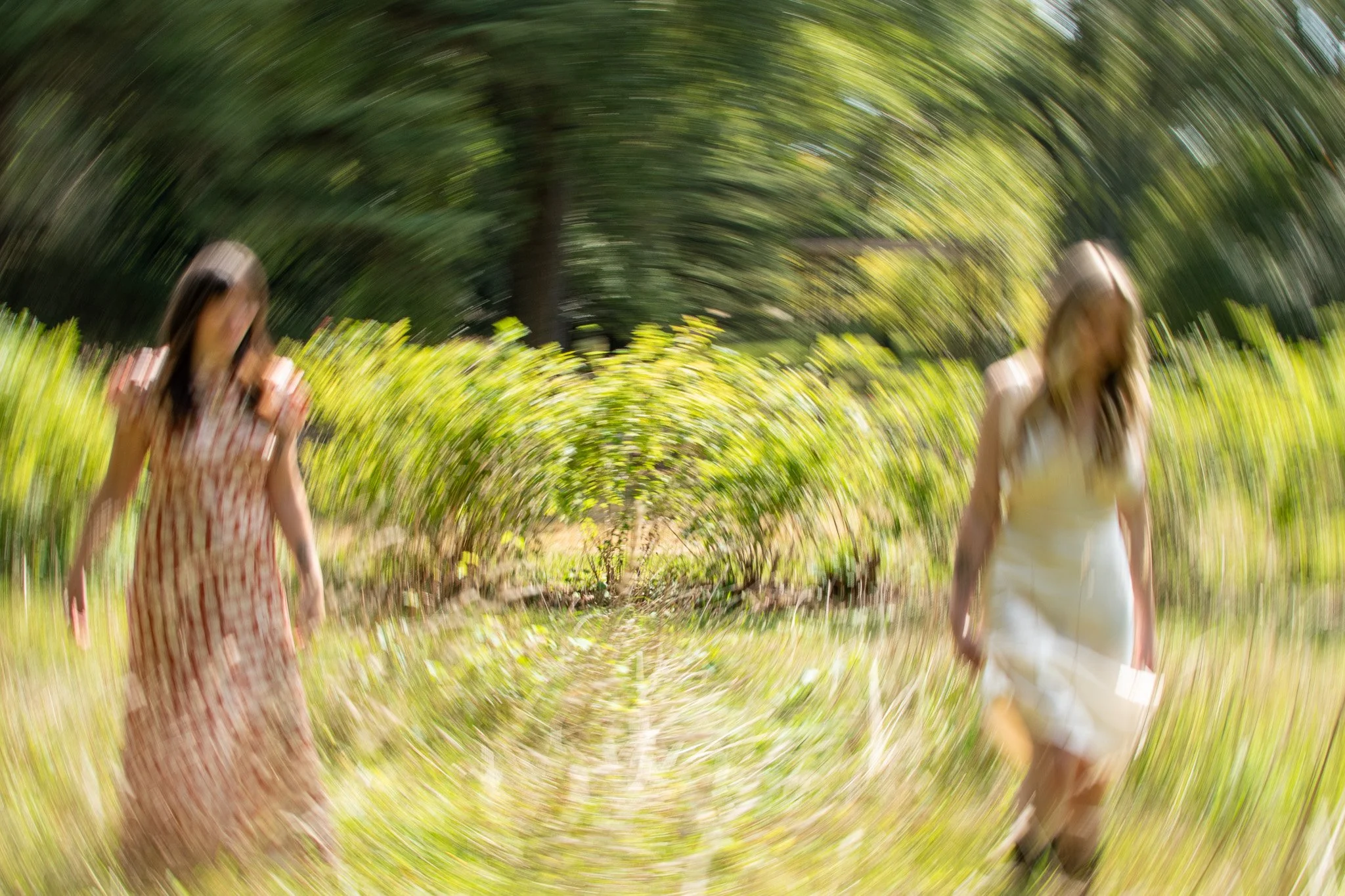 Two therapists running in a field connecting to their inner-child