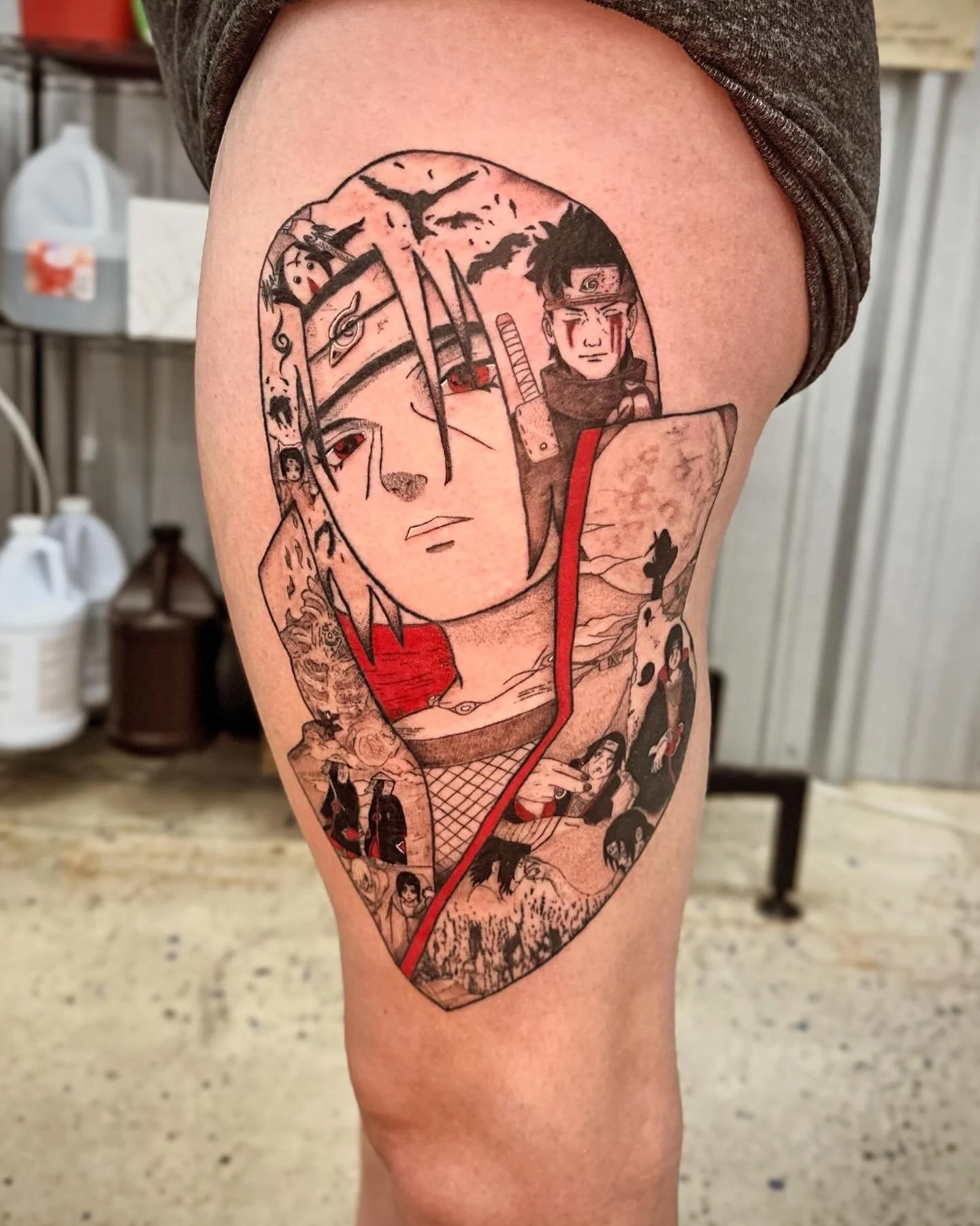 Tattoo featuring characters from the anime Naruto, including Naruto Uzumaki and Sasuke Uchiha, with a background of mountains and crows.