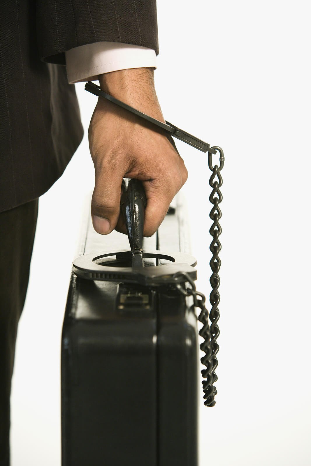A man's wrist chained to a briefcase. Is contamination OCD and overwhelming disgust keeping you chained to rituals that control your daily life? OCD therapy in Wauwatosa, WI, can help you break free from compulsive patterns for good.