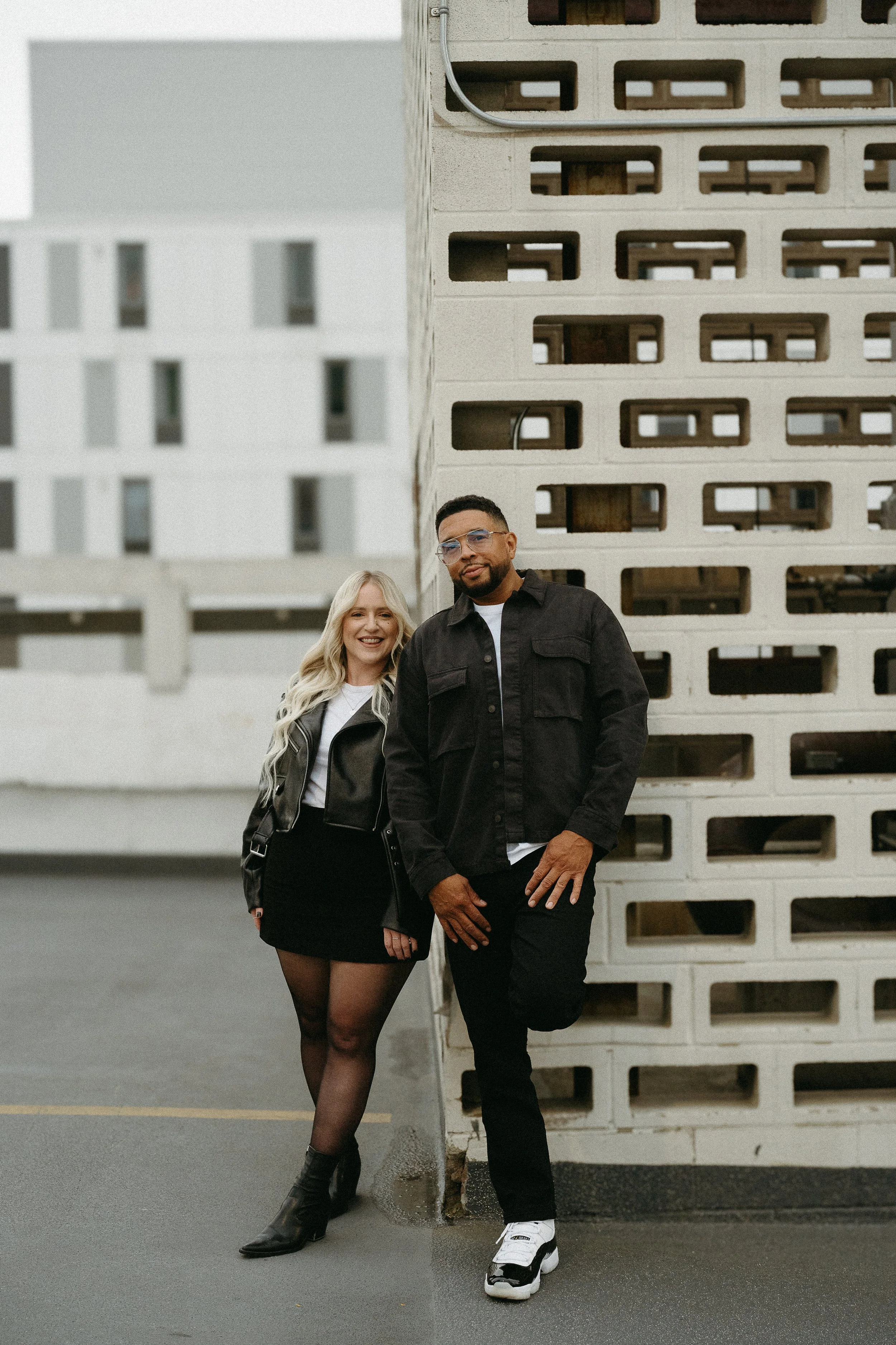 Calgary, Alberta.   Couples photo session in Downtown Calgary with the Palliser Hotel in the background, shot by KC Photography