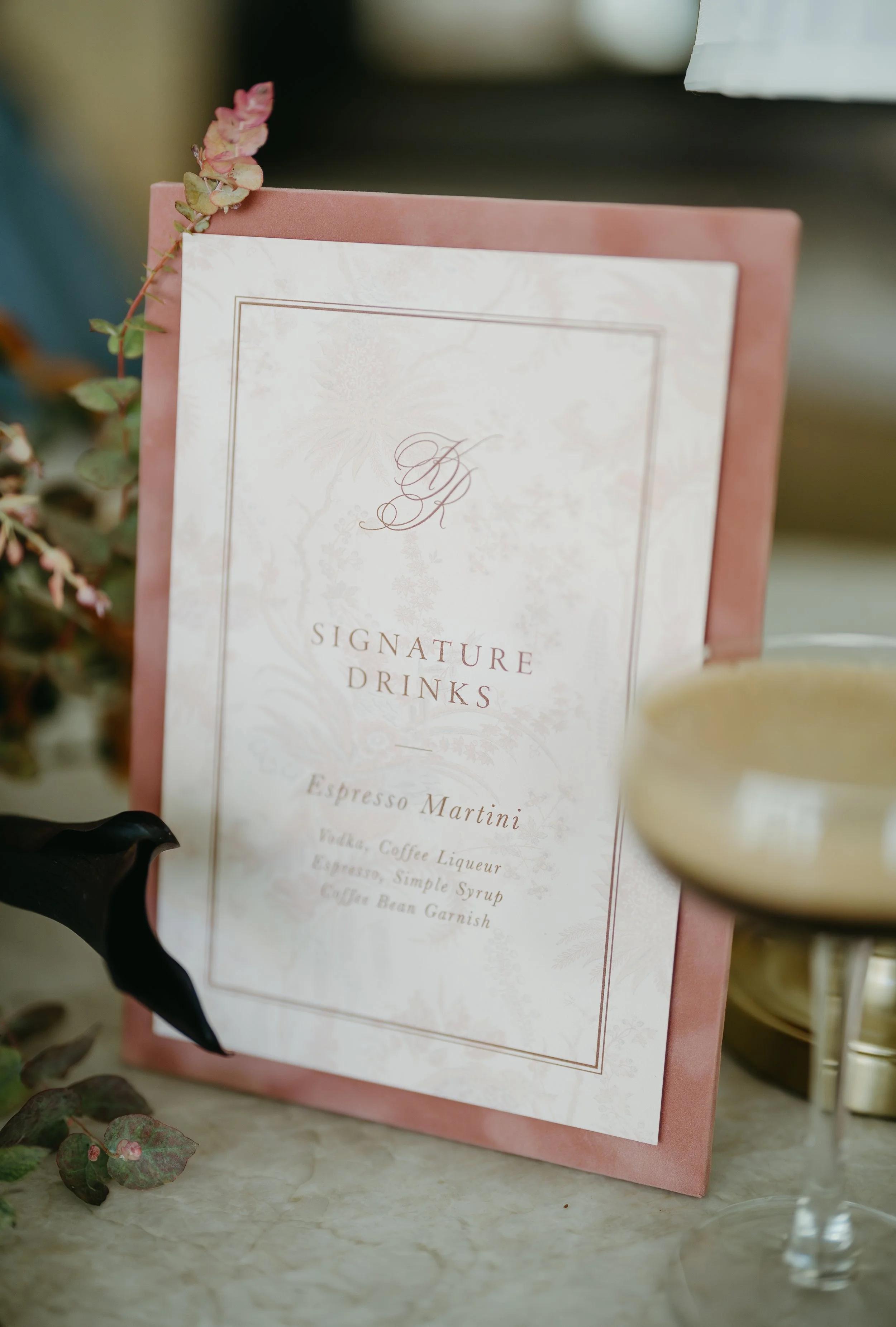 A recipe for a wedding reception's signature drink, espresso martini, placed on. a countertop. July 2025 Calgary Elopement/Wedding Editorial Session with KC Photography