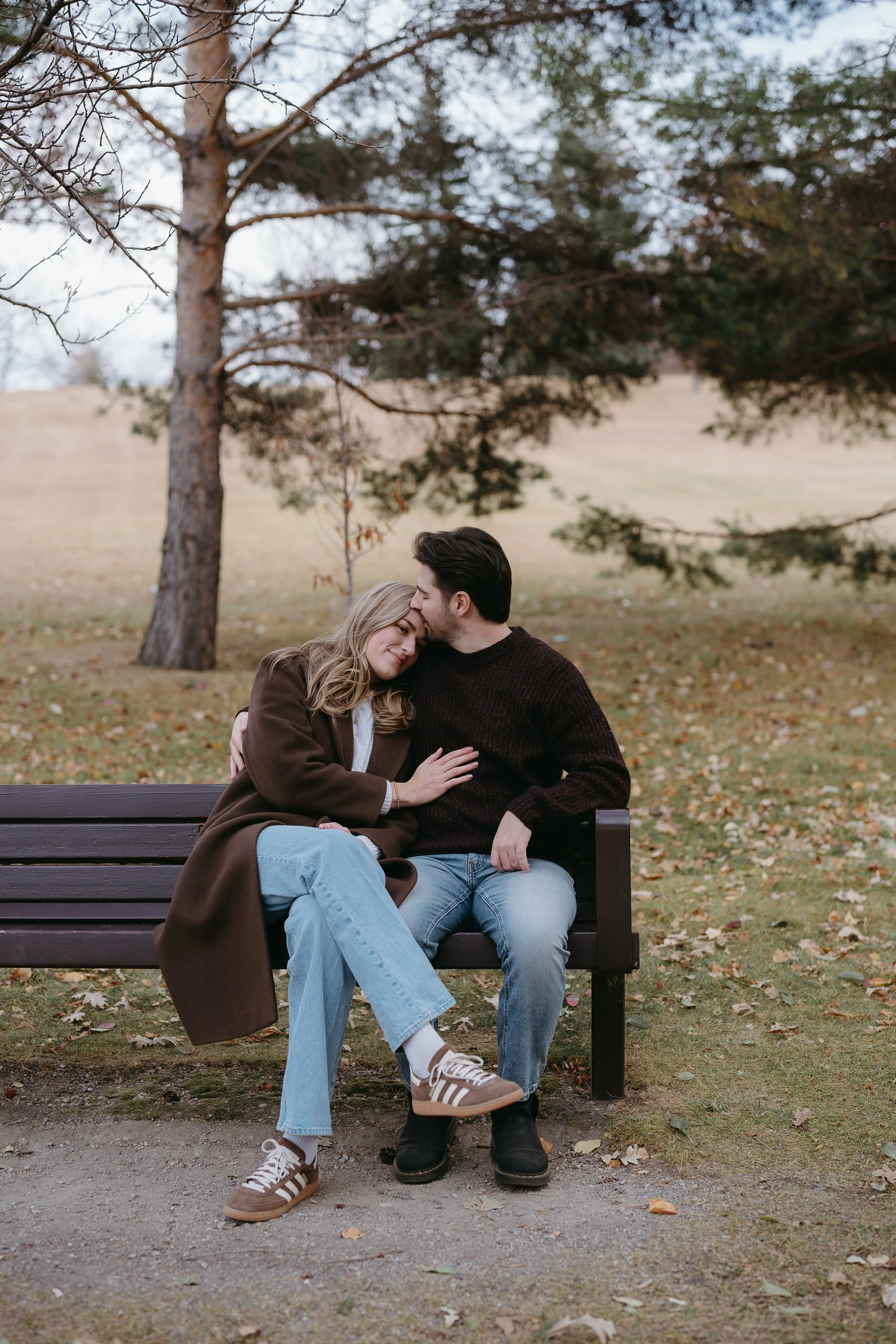 Calgary, Alberta. Engagement Session of couple in Confederation Park, shot by KC Photography